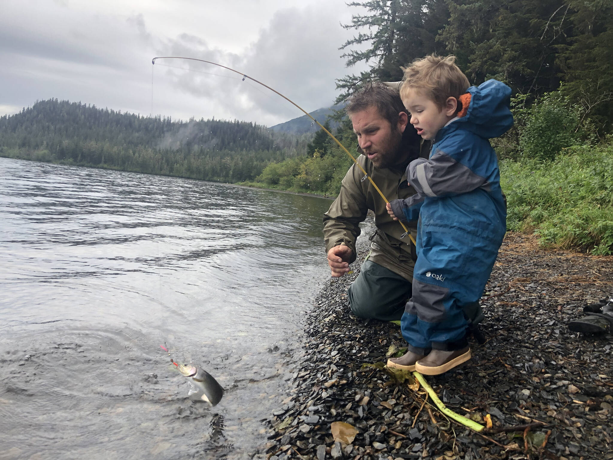 Courtesy Photo / Mary Catharine Martin 
Shiras Dihle, age 2, reels in a cutthroat with the help of his dad, Bjorn Dihle.