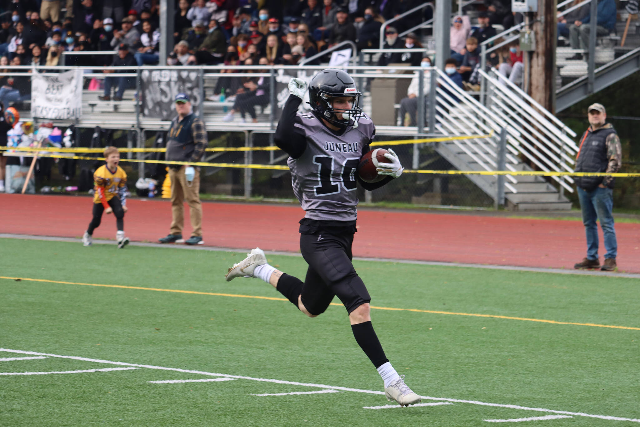 James Connally, a senior, makes his way toward the end zone to open the scoring for the Juneau Huskies. Connally also caught a pair of touchdowns in a 42-7 win against South Anchorage High School. (Ben Hohenstatt / Juneau Empire)