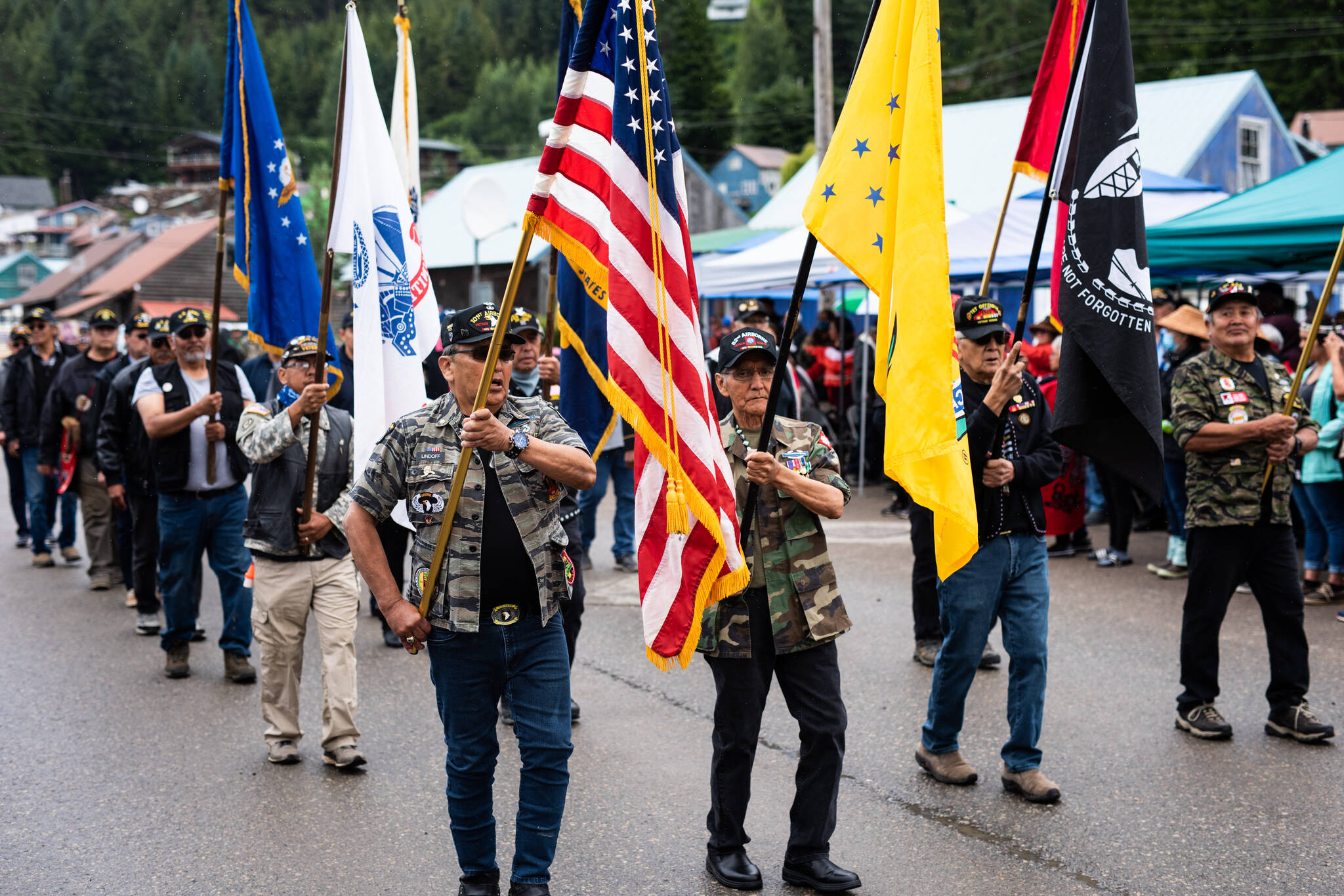 Veterans march in Hoonah for the raising of a totem pole honoring Southeast Akaska’s Indigenous veterans. The region, and Hoonah in particular, have a high number of veterans per capita. (Courtesy Photo / Ian Johnson)