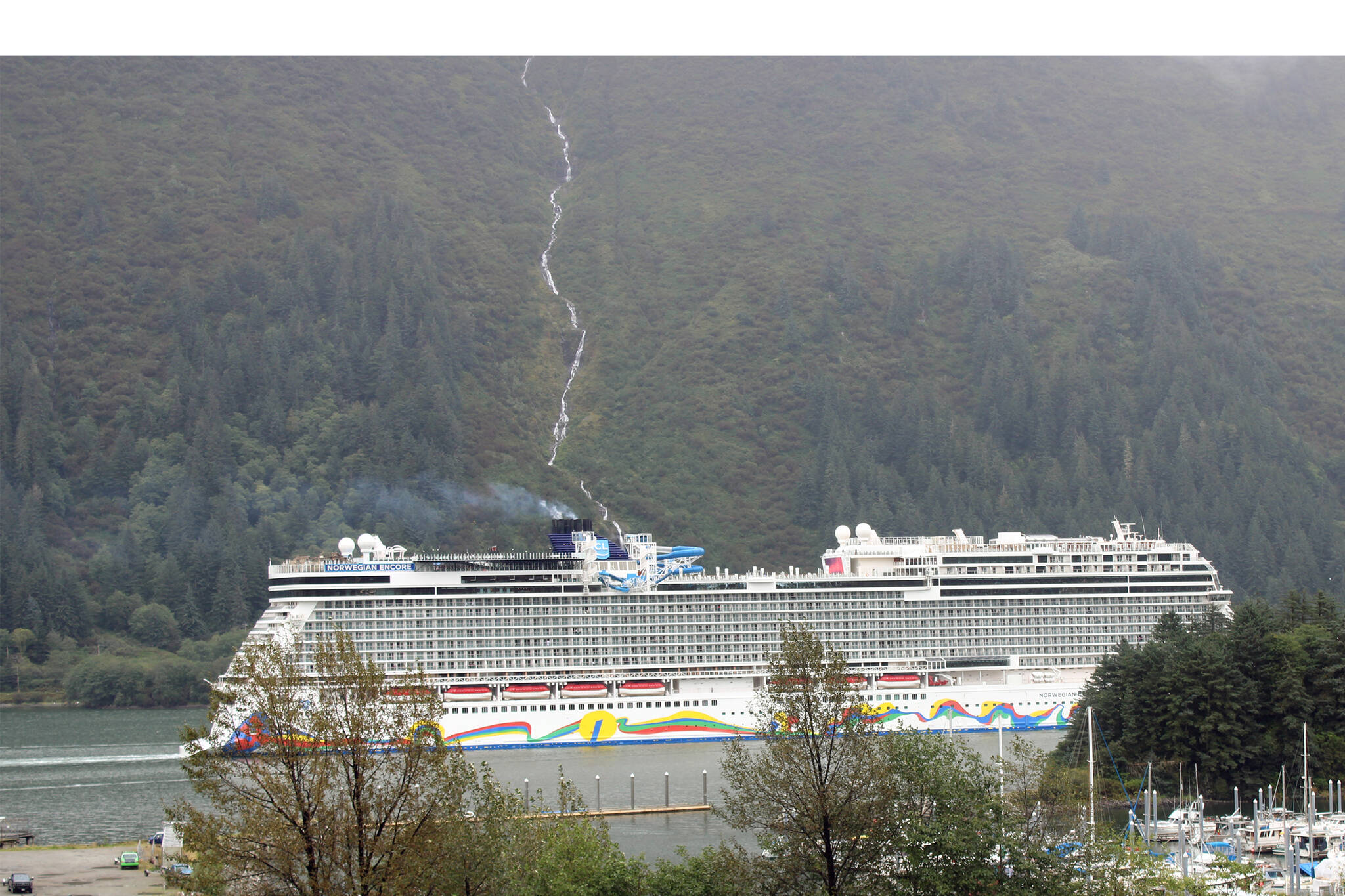 The Norwegian Encore sails past Douglas Island on Sept. 8, 2021. The Encore was visiting Juneau as part of an abbreviated cruise season this summer after COVID-19 canceled the 2020 season. The City and Borough of Juneau is currently offering an online survey for residents to share their views on the tourism industry. One of the survey questions addresses the proposal from Norwegian Cruise Lines to build a cruise ship dock on its waterfront property on Egan Drive. (Dana Zigmund/Juneau Empire)