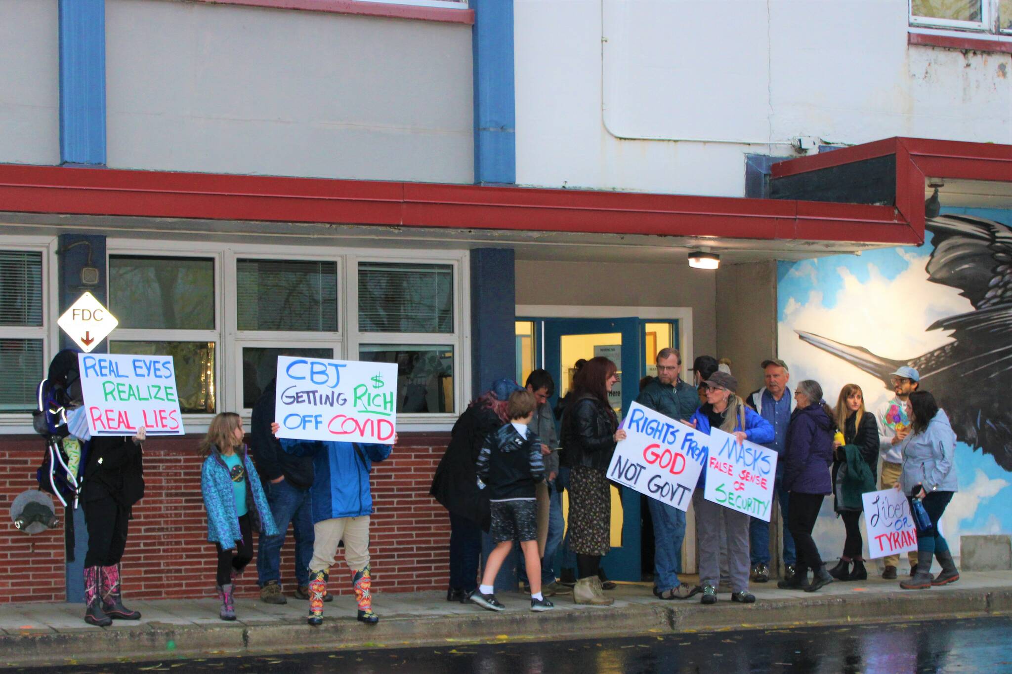 Several people participated in a rally in front of City Hall on Sept. 29, before the city assembly considered extending the current COVID-19 mitigation measures. At the meeting, assembly members voted to extend the measures through March 1, 2022. (Dana Zigmund/Juneau Empire)