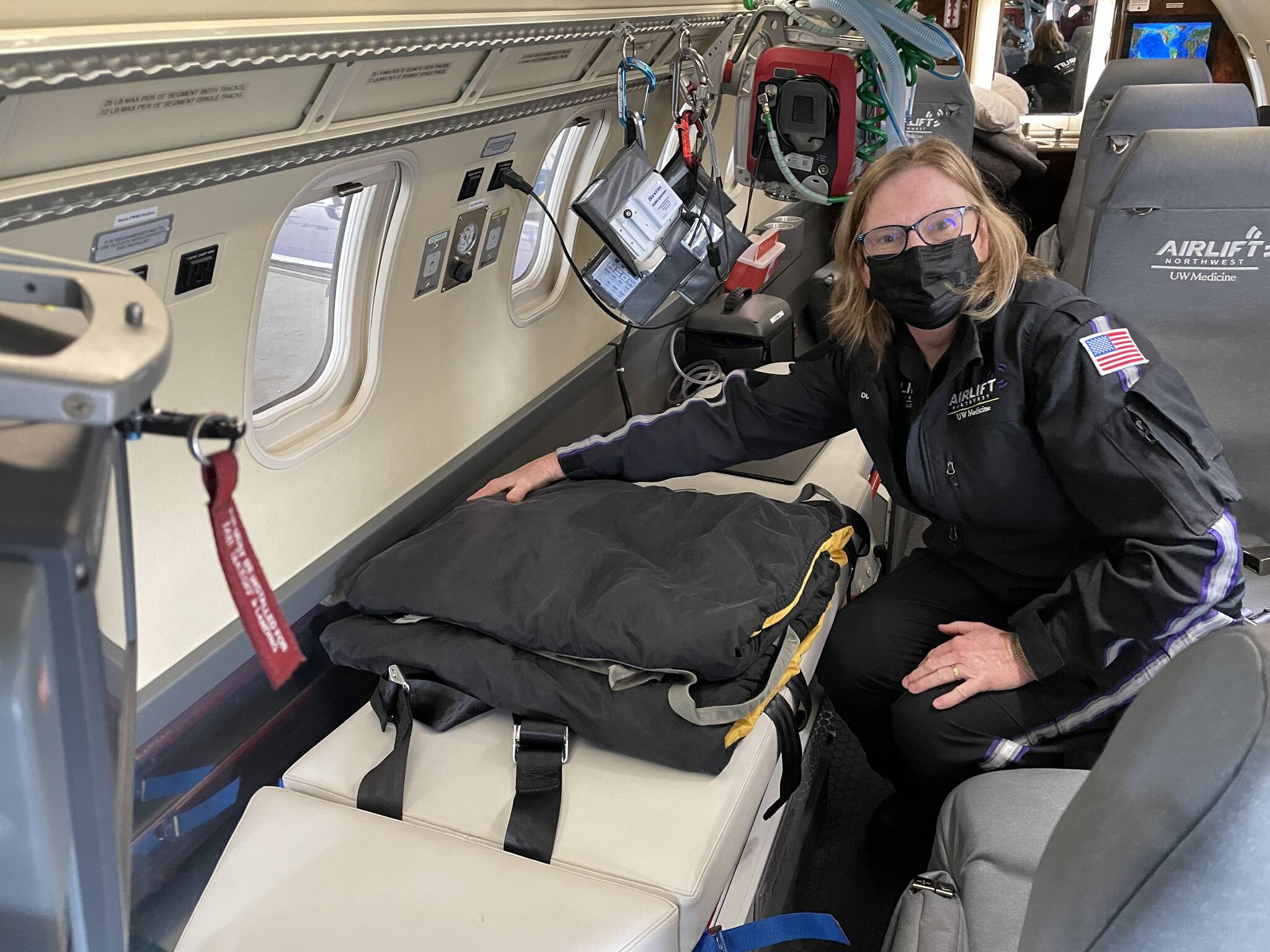 Michael S. Lockett / Juneau Empire 
Airlift Northwest flight nurse Diana Paul shows off some of the improved patient care features of the medevac organization’s new Learjet 45XR aircraft, recently arrived in Juneau for service around the Southeast, on Sept. 30, 2021.