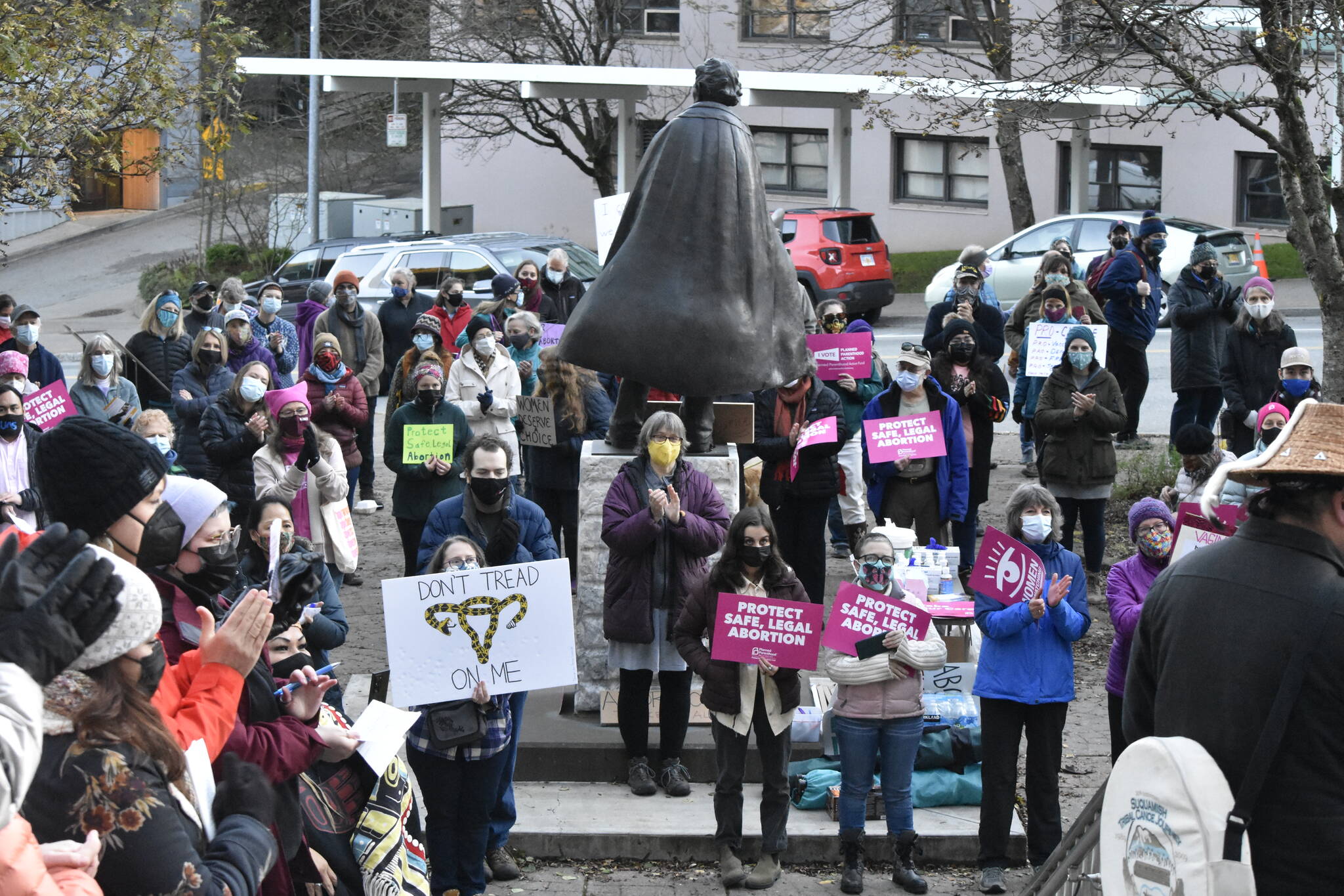Juneau residents gathered around the statue of William H. Seward in downtown Juneau on Monday, Oct. 4, 2021, for the local version of a national rally for abortion rights. (Peter Segall / Juneau Empire)