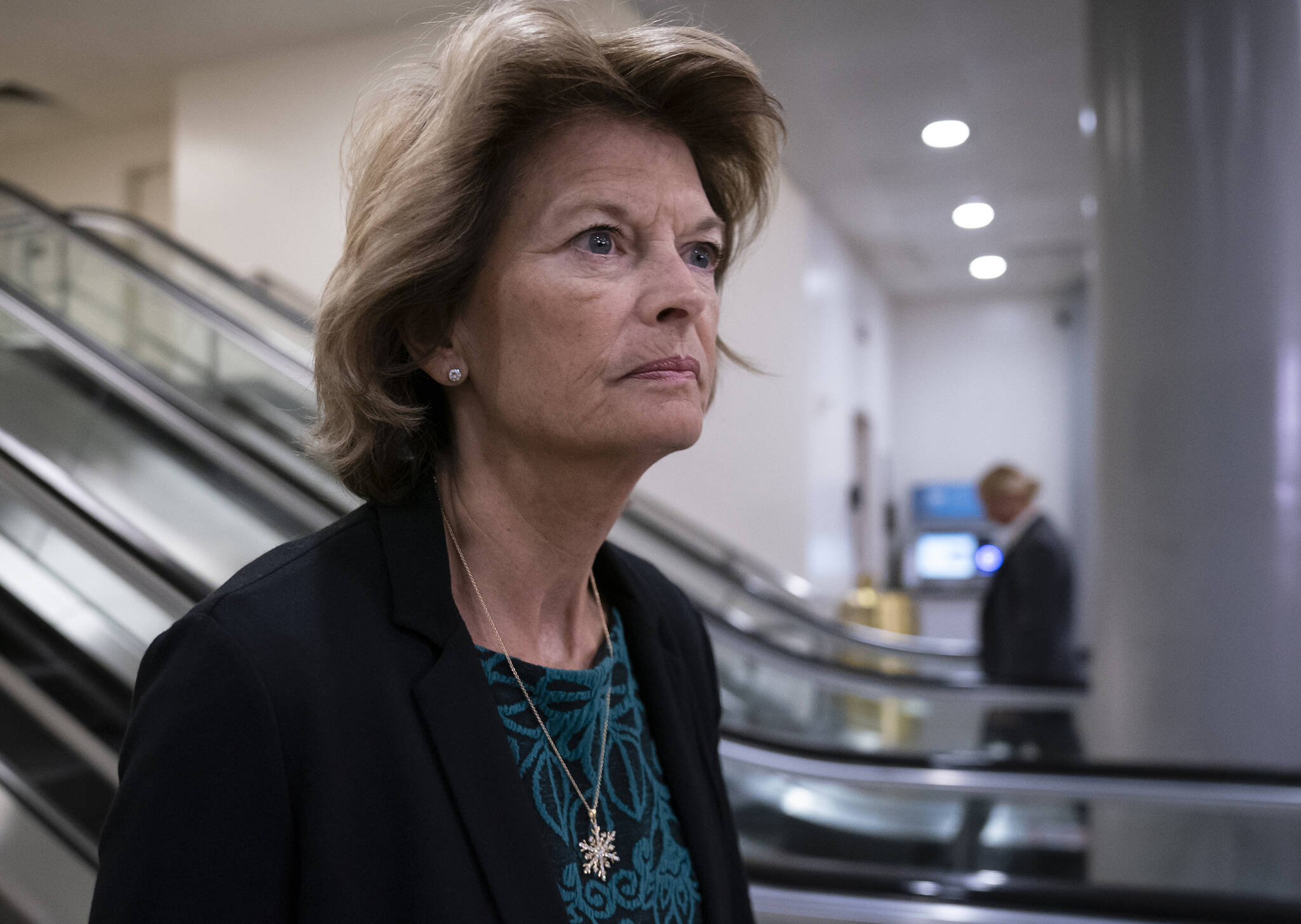 In this Jan. 8, 2020, photo Sen. Lisa Murkowski, R-Alaska, heads to a briefing on Capitol Hill in Washington. An Alaska man faces federal charges after authorities allege he threatened to hire an assassin to kill Murkowski, according to court documents unsealed Wed., Oct. 6, 2021. (AP Photo/J. Scott Applewhite,File)