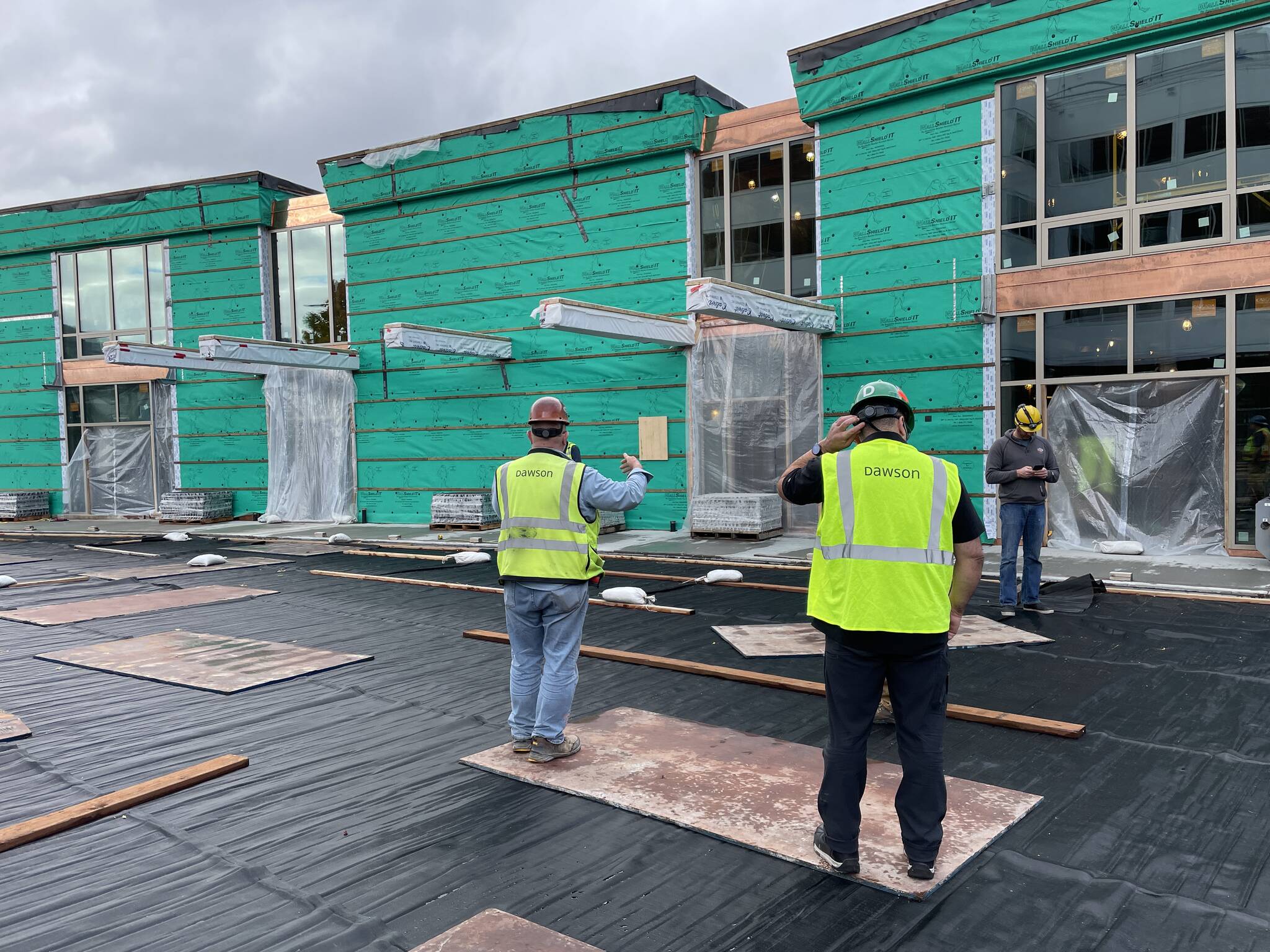 Workers make progress on the Sealaska Heritage Institute’s Northwest Coast arts campus on Sept. 24. Supply chain issues and material shortages have been a factor for local construction projects this year. (Michael S. Lockett/Juneau Empire)
