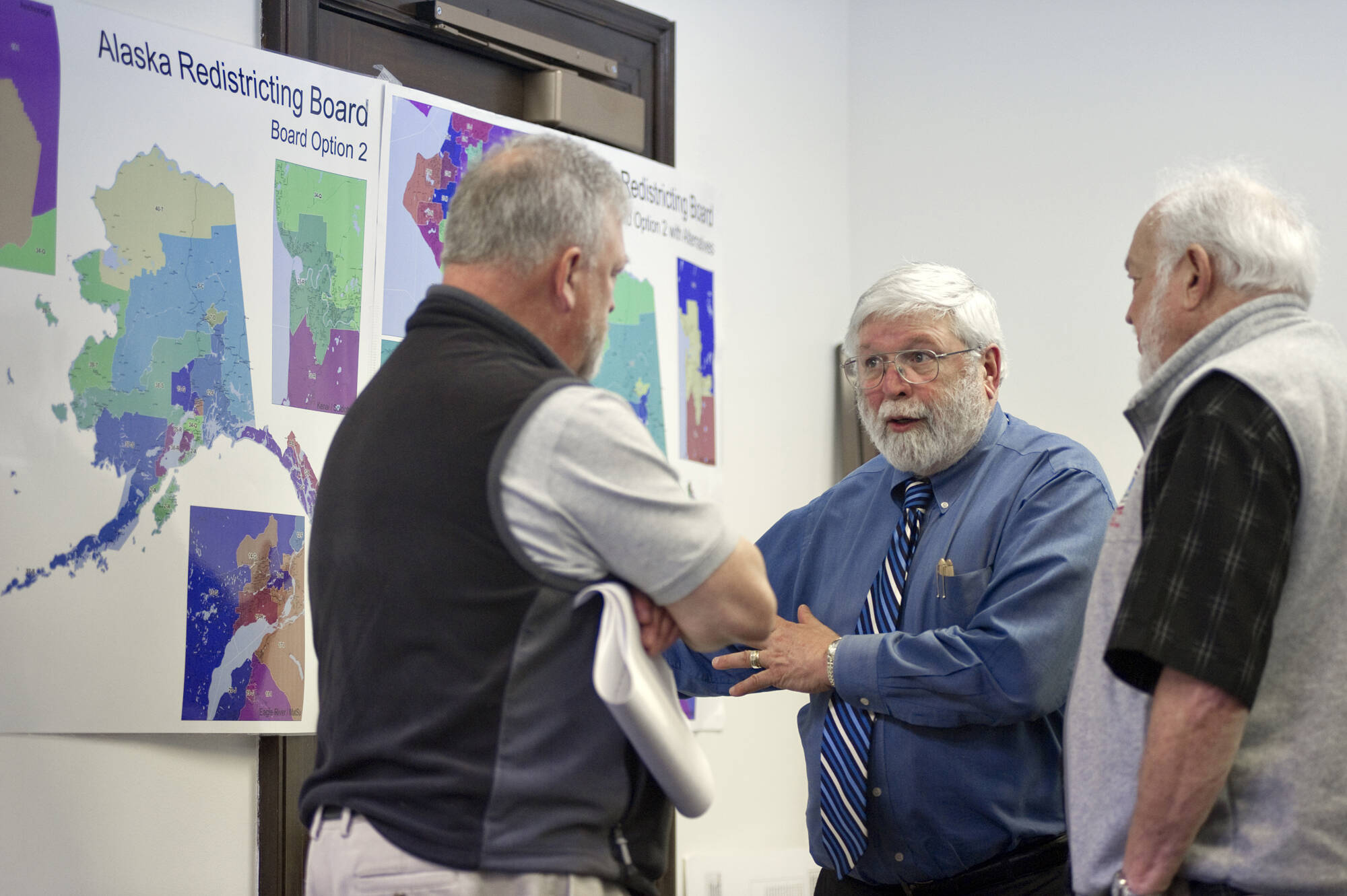 Michael Penn / Juneau Empire File
Then-Juneau Mayor Bruce Botelho, left, and former Juneau Representative Bill Hudson, right, speak with John Torgerson, chairman of the Alaska Redistricting Board during a break in hearing public testimony at the Capitol Wednesday, April 20, 2011. Alaskas state flags were lowered Thursday for longtime Alaska lawmaker, Hudson, who died Oct. 11.
