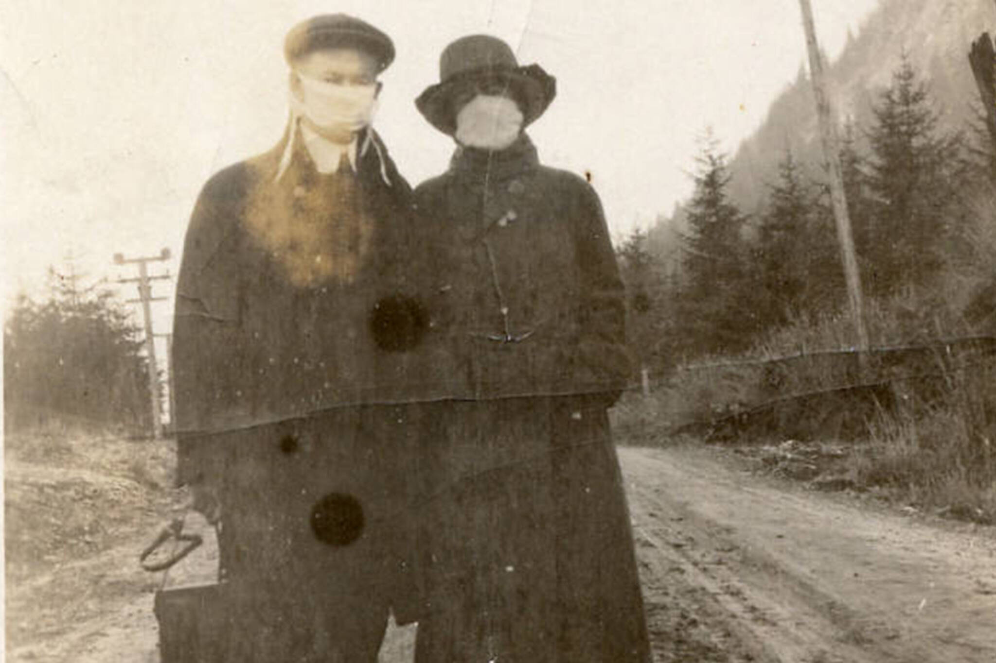 Alaska State Library - Historical Collections 
This photo from the Harry and Carrie Dott photograph collection shows two masked people together during the 1918 flu pandemic. The photo has been cropped from its original dimensions.