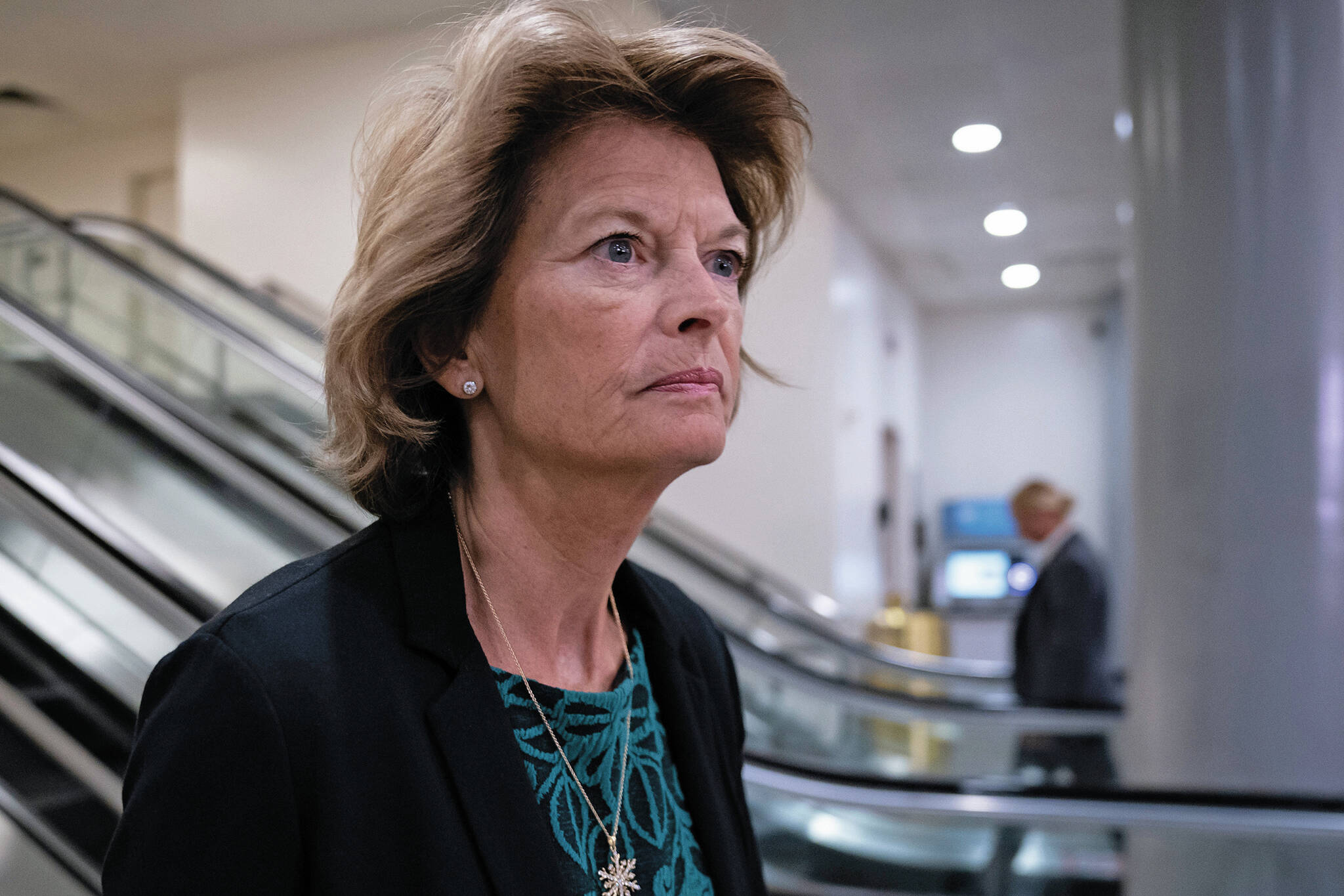 Sen. Lisa Murkowski, R-Alaska, heads to a briefing on Capitol Hill in Washington. She reported raising almost $1.1 million last quarter. (AP Photo / J. Scott Applewhite)