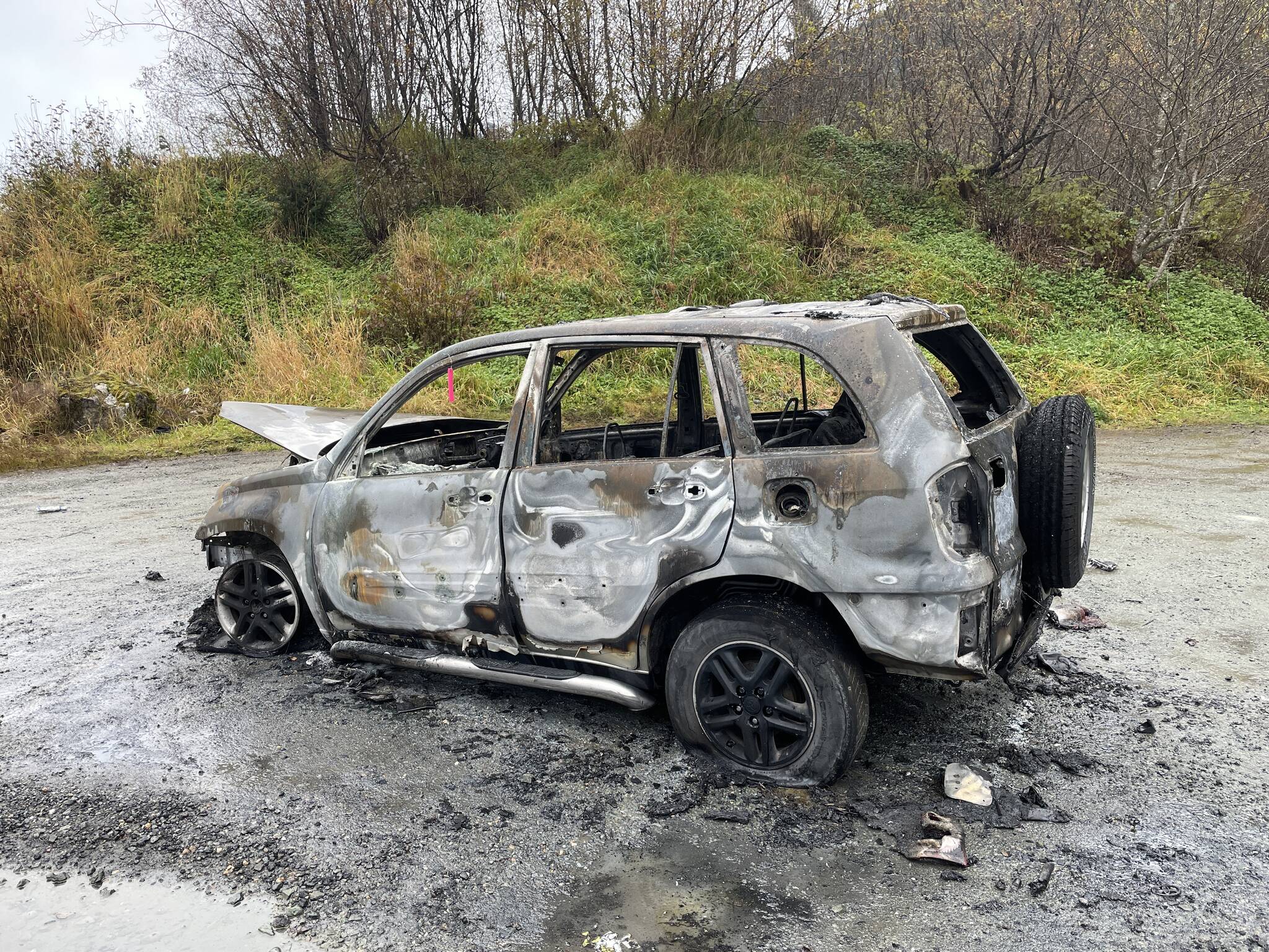 Capital City Fire/Rescue fire marshal Dan Jager said a vehicle on Valley Boulevard was destroyed early Wednesday morning in what appears to be an intentionally set fire, Oct. 20, 2021. (Michael S. Lockett / Juneau Empire)