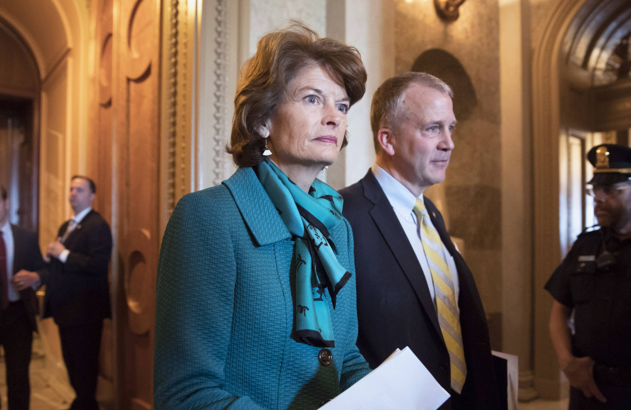 Sen. Lisa Murkowski, R-Alaska, and Sen. Dan Sullivan, R-Alaska, leave the chamber after a vote on Capitol Hill in Washington, early Wednesday, May 10, 2017. A magistrate ruled Tuesday, Oct. 19, 2021, that there is probable cause for a case to continue against a man accused of threatening to kill Alaska’s two U.S. senators in profanity-filled voicemails left on their office phones. (AP Photo / J. Scott Applewhite)