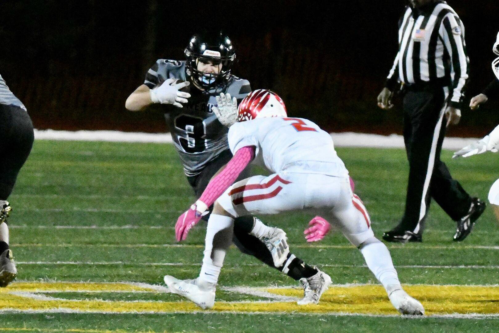 Gaby Soto makes a move against an East Anchorage defender during the Division I football state championship game played Friday night at Service High School in Anchorage. (Courtesy Photo / Larry Schrader)