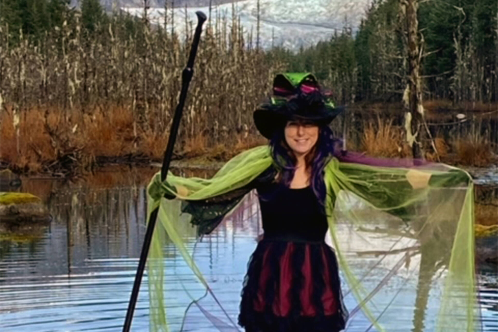 Spooks, spirits and shadowy shapes await visitors to the Juneau Huskies Haunted Hallow event, happening Friday, Saturday and Sunday. (Courtesy photo/Sam Adams)
Bev O’Brein shows off a witch costume in advance of the Auke Lake Witches Parade—a do-it-yourself flotilla designed to celebrate the season, and scheduled for Saturday. (Courtesy photo/Allan Edwards)
