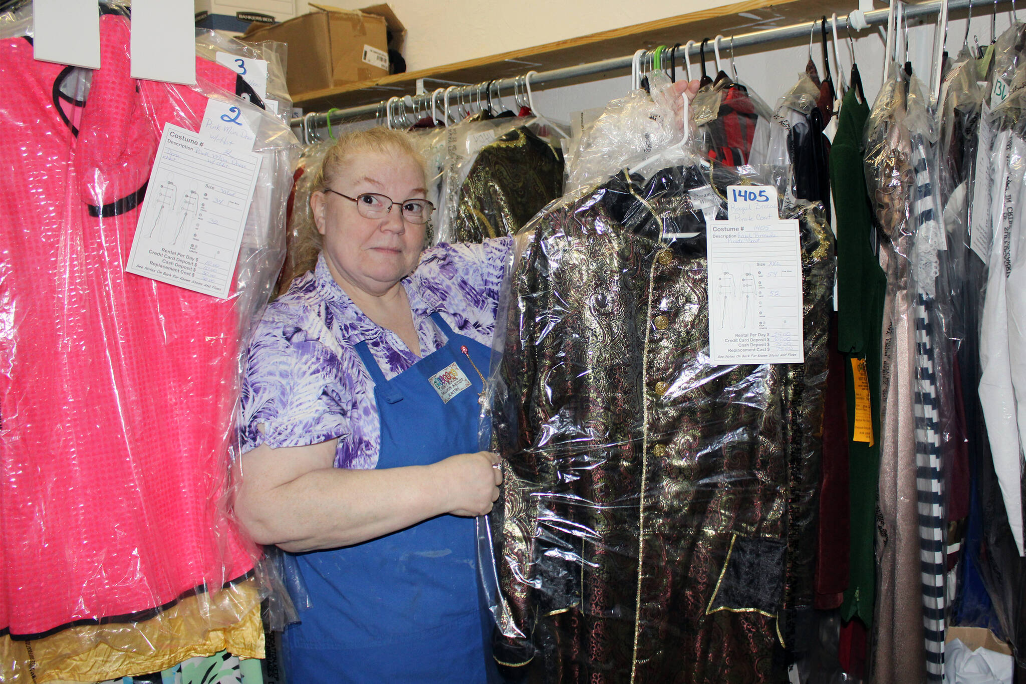 Kathy Buell, owner of Balloons by Night Moods, shows off a pirate costume on Oct. 27. The costume is one of more than 2,000 on hand for rental. (Dana Zigmund/Juneau Empire)