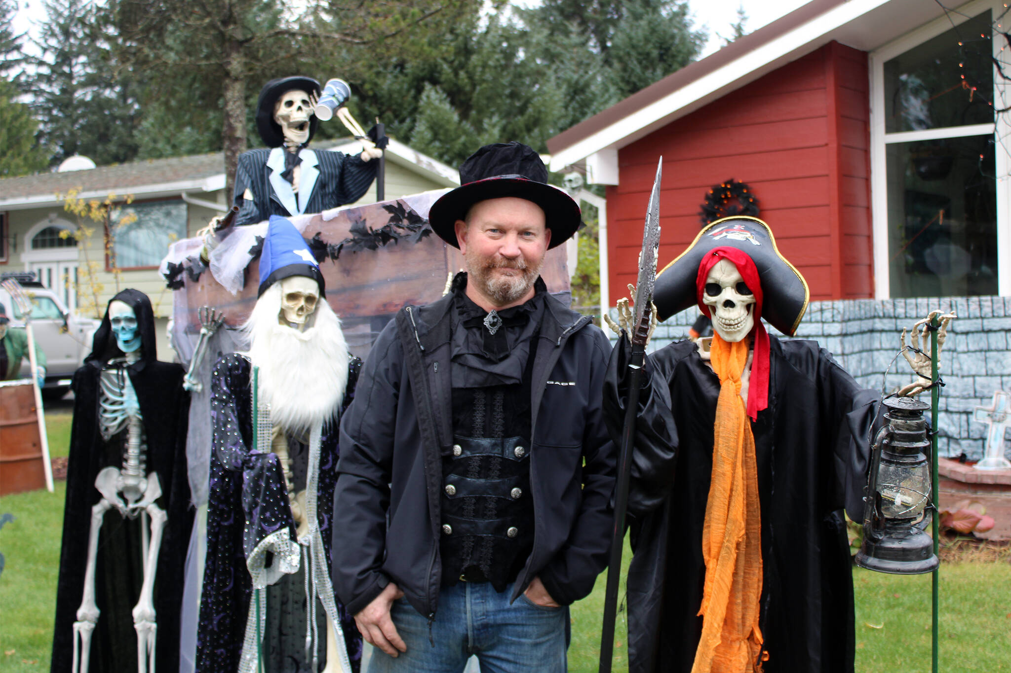 On Oct. 26, Dan Earls stands among some of the ghosts and ghouls that greet people who visit the haunted garage he constructs at his home each year. Earls, who lives at 9420 Berners Ave., welcomes hundreds of people a season to his display, which winds through his garage and spreads onto a neighbor's yard. (Dana Zigmund/Juneau Empire)