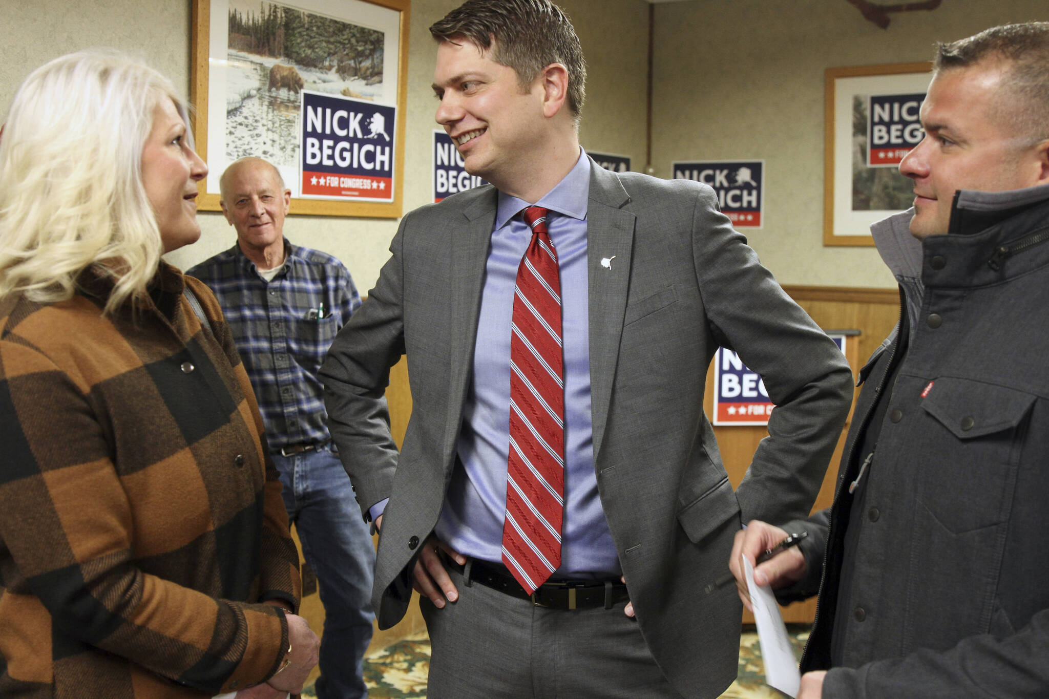 Nicholas Begich III (middle) speaks with supporters ahead of announcing his plans to run for Alaska’s lone U.S. House seat on Thursday, Oct. 28, 2021, in Wasilla, Alaska. Begich, a Republican, plans to run for the seat that has been held since 1973 by Republican Rep. Don Young. (AP Photo / Mark Thiessen)