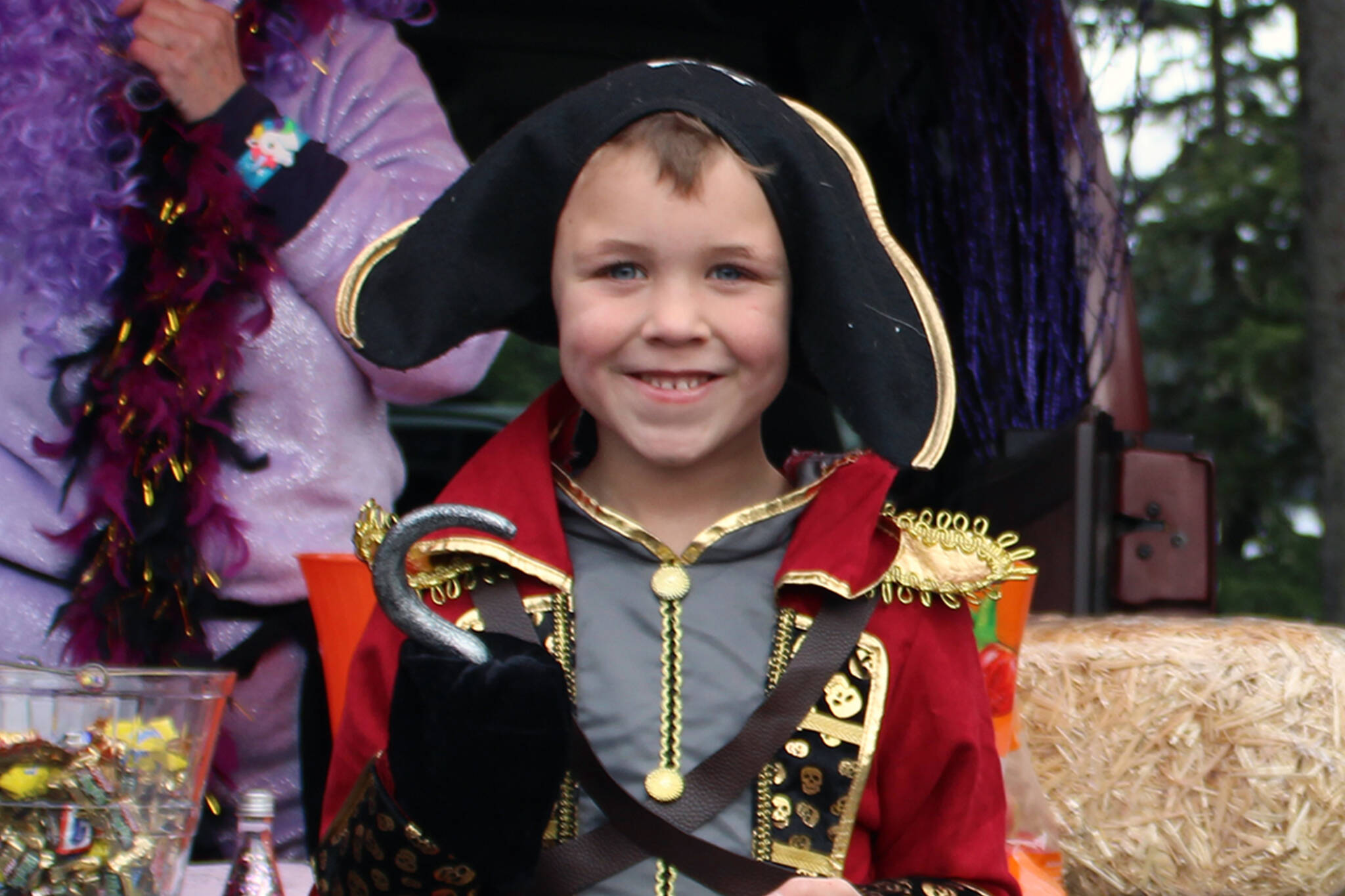Five-year-old Leighton Howard has a swashbuckling good time trunk-or-treating on Saturday, Oct. 30 at Chapel by the Lake. (Dana Zigmund/Juneau Empire)