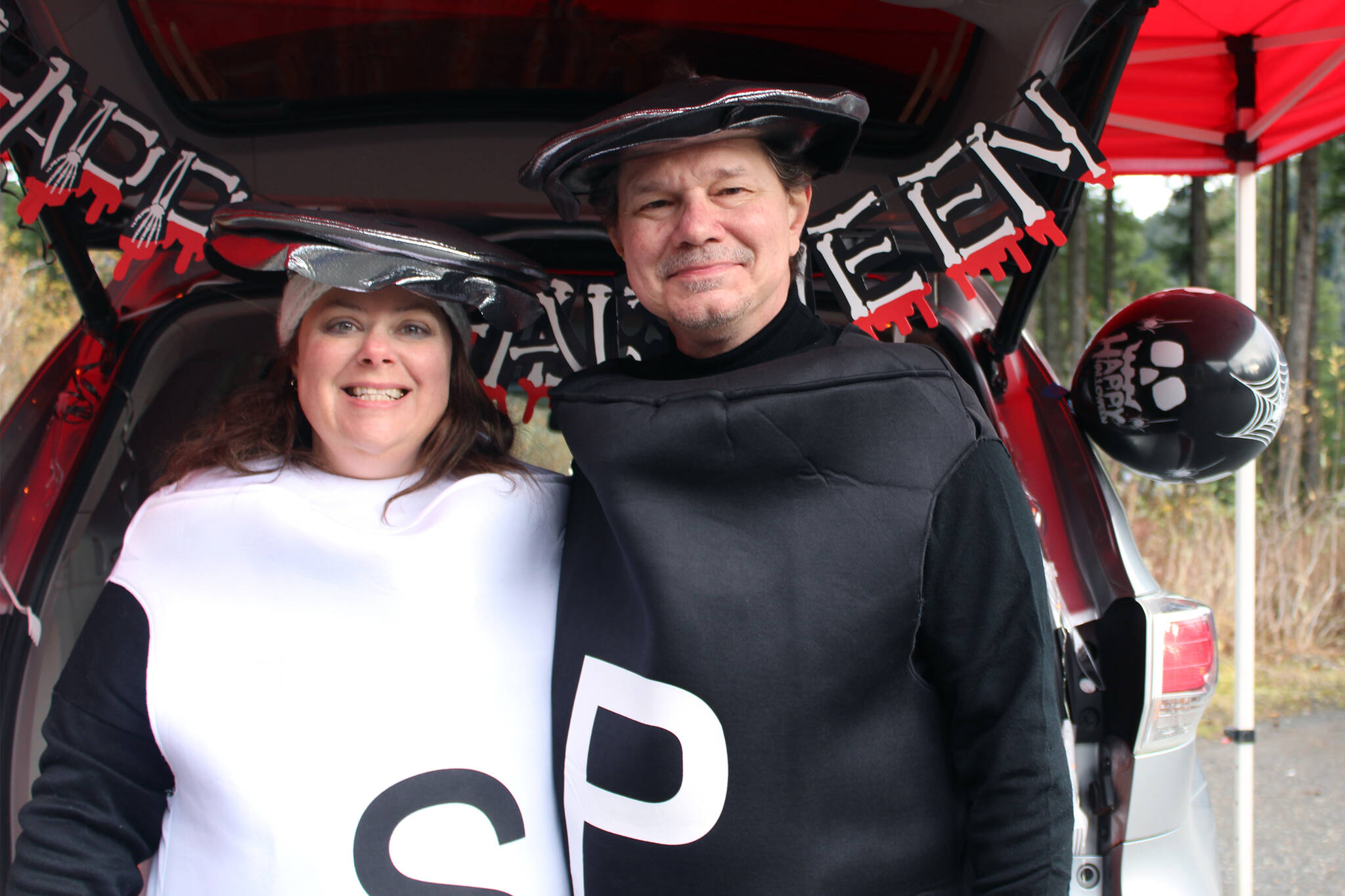 Tillia and Mark Everett keep it seasonal at the trunk or treat sponsored by Chapel by the Lake on Saturday, Oct. 30. (Dana Zigmund/Juneau Empire)