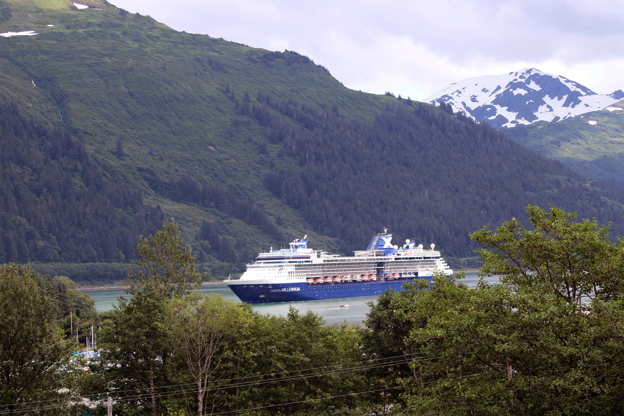The Celebrity Millennium sails into the Port of Juneau early on the morning of July 26, 2021. During this voyage, onboard purchases were exempt from the City and Borough of Juneau’s sales tax. However, a new ordinance winding through the City Assembly could change that for next year. (Dana Zigmund/Juneau Empire)