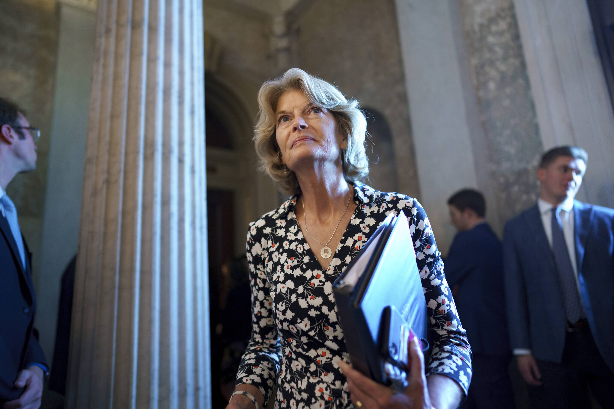 Sen. Lisa Murkowski, R-Alaska, walks to the chamber at the Capitol in Washington, Thursday, Aug. 5, 2021. Murkowski, who voted to convict Donald Trump in his second impeachment trial and has repeatedly bumped heads with the former president, announced Friday, Nov. 12, that she will run for reelection. (AP Photo/J. Scott Applewhite)