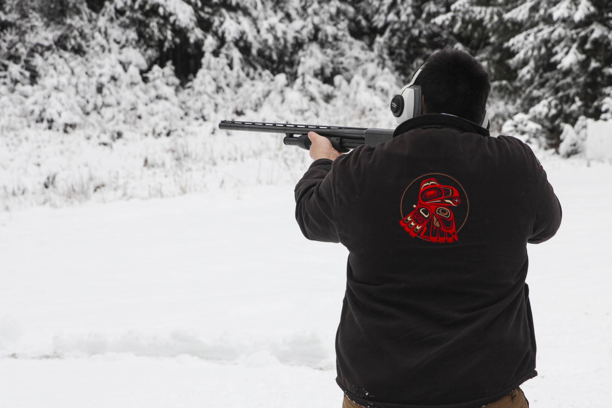 Derek St Clair aims at a target during the Juneau Gun Club’s annual Turkey Shoot on Nov. 20, 2021. (Michael S. Lockett / Juneau Empire)