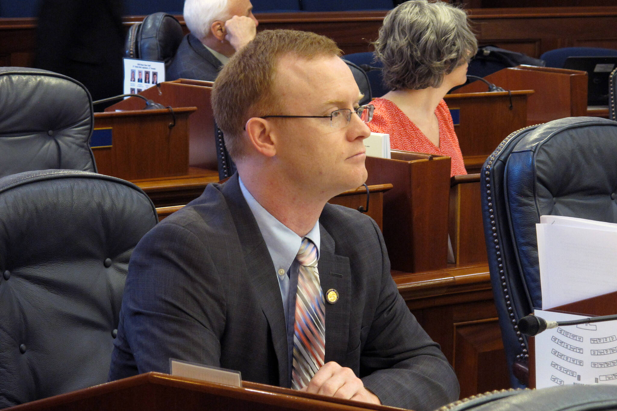 State Rep. David Eastman sits at his desk on the Alaska House floor in Juneau, Alaska, on March 5, 2020. Dozens of West Point graduates have demanded state Rep. Eastman resign from office over his ties to a right wing extremist group, saying his affiliation has betrayed the values of the U.S. Military Academy he attended. (AP Photo / Becky Bohrer)
