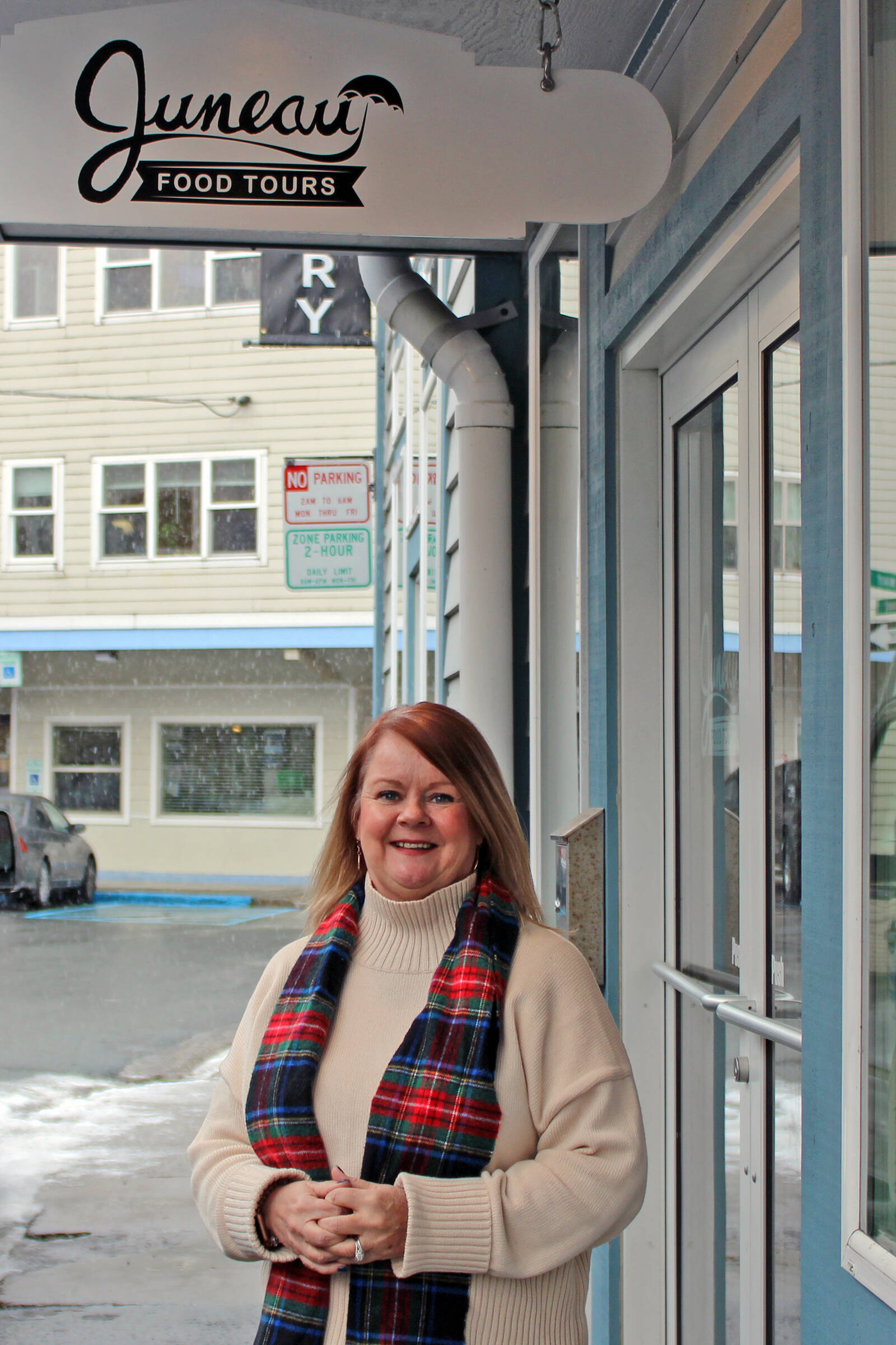Midgi Moore, Juneau Food Tours’ CEO, stands outside her shop on Nov. 23. She is one of many local business owners whose businesses have been severely harmed by the disruption to cruise ship travel caused by COVID-19. She said in 2019, her business hosted over 3,000 customers on food tours. In 2020, that number plummeted to 24. She’s served 775 customers as of Nov. 7, 2021. (Dana Zigmund / Juneau Empire)
