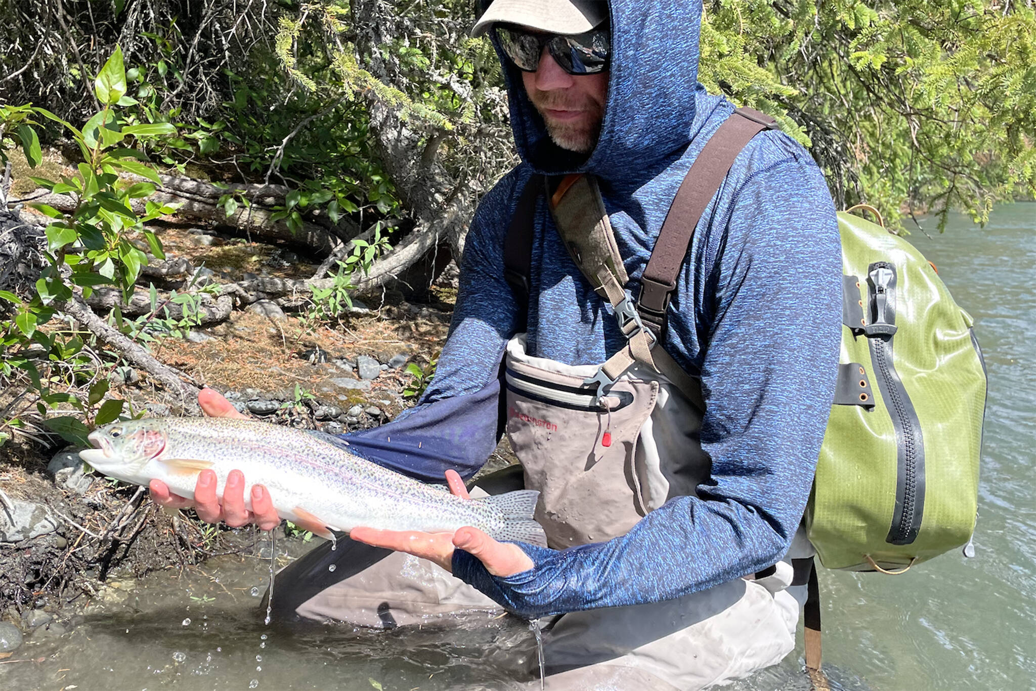 The author with a Kenai River rainbow caught during his honeymoon in June. (Jeff Lund / for the Juneau Empire)