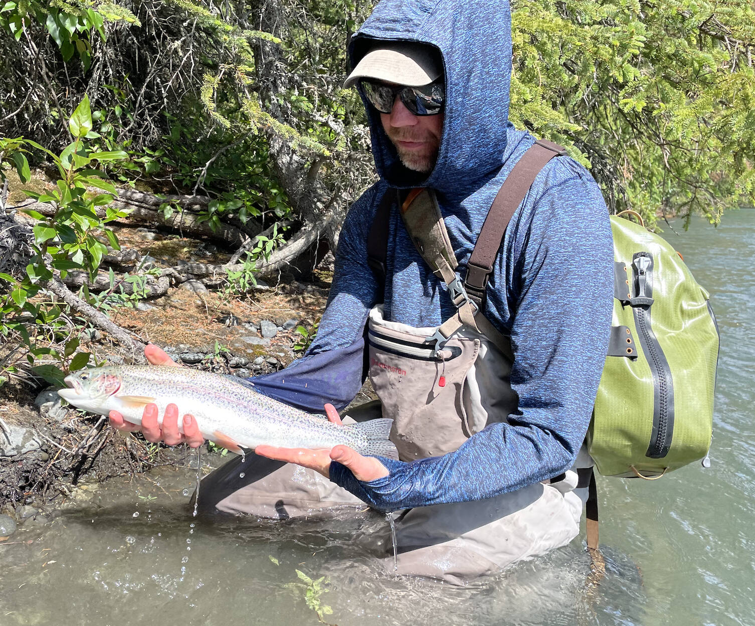 The author with a Kenai River rainbow caught during his honeymoon in June. (Jeff Lund / for the Juneau Empire)