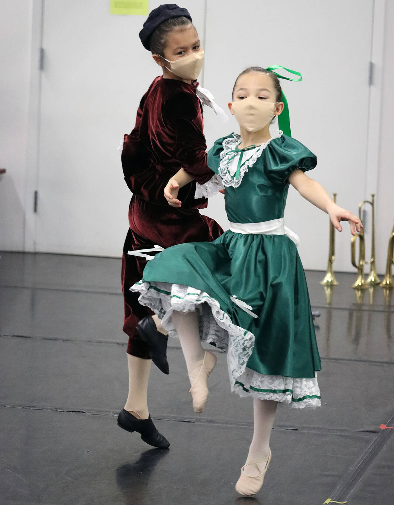 Brigitte Ouellette rehearses the role of Fritz along with Sachiko Marks, who is portraying a party goer in “The Nutcracker” rehearsal on Saturday, Nov. 27. (Ben Hohenstatt/Juneau Empire)