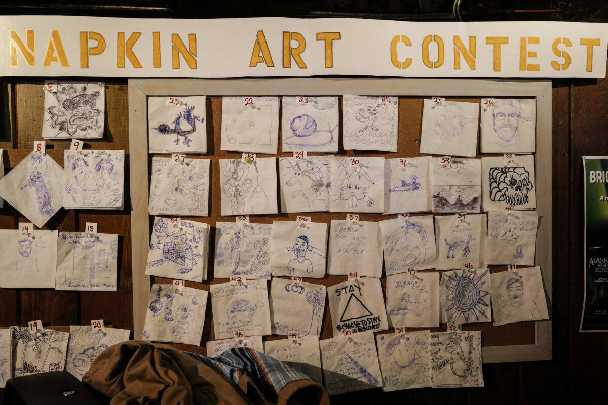 Napkin Art Contest contenders at the Triangle Bar during Gallery Walk on Friday, Dec. 6, 2019. Gallery Walk returns in-person to downtown in 2021 with events and live music on Dec. 3, 2021. (Michael Penn / Juneau Empire file)