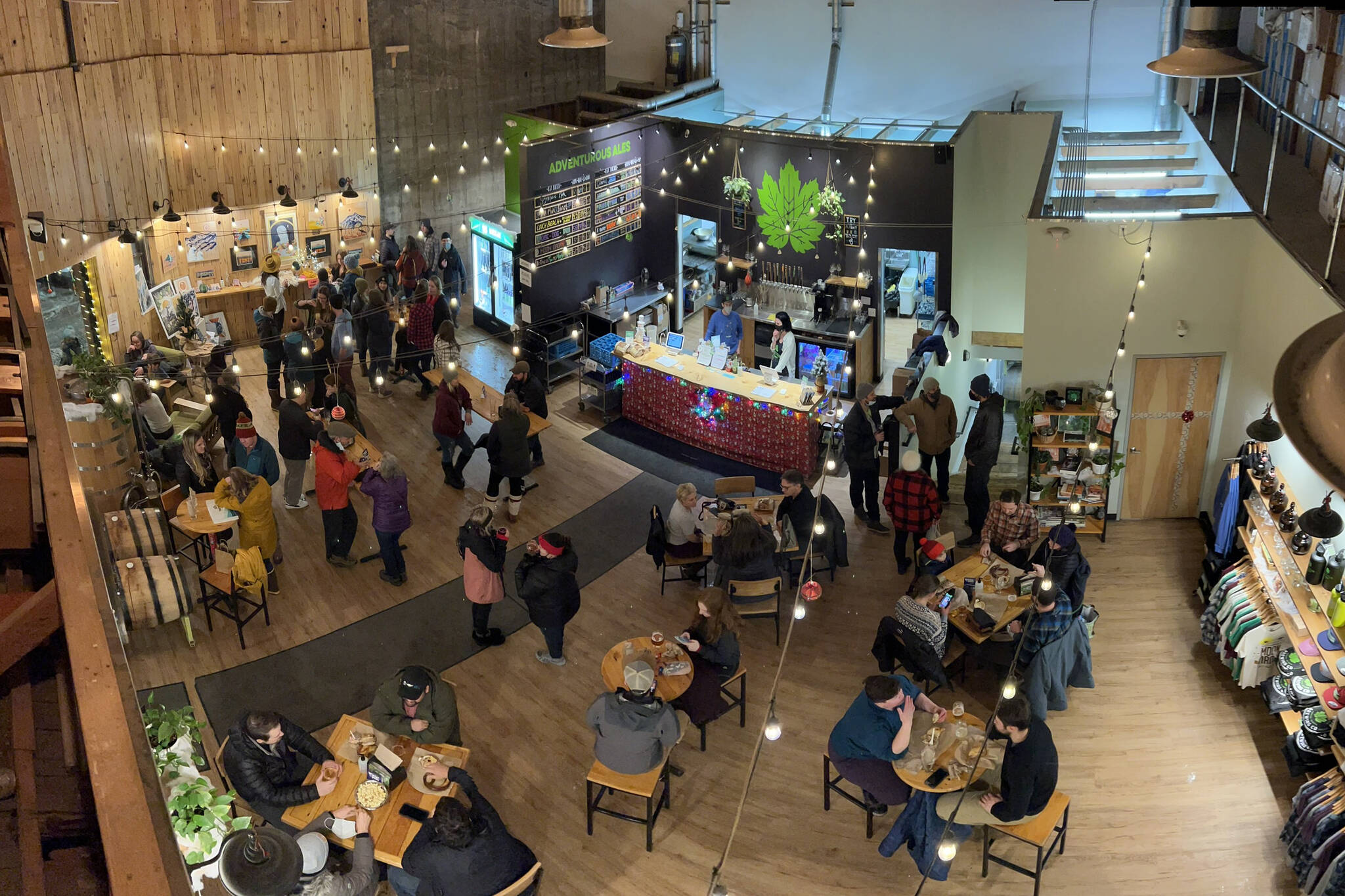 Juneau residents enjoy Gallery Walk at Devil’s Club Brewing Company, which hosted artist Jacqui Tingey. (Courtesy photo / Mircea Brown)