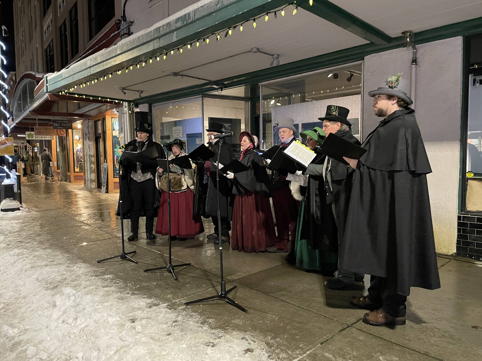 Singers of Vox Borealis carol during Gallery Walk on Dec. 3, 2021. (Michael S. Lockett / Juneau Empire)