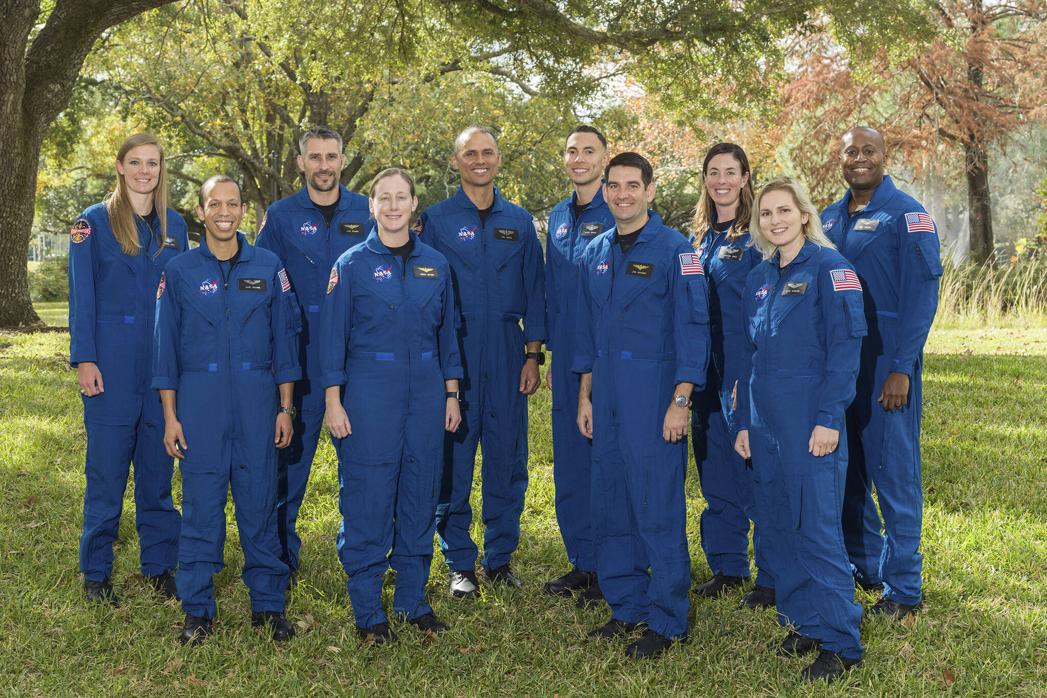 This photo provided by NASA shows its 2021 astronaut candidate class, announced on Monday, Dec. 6, 2021. The 10 candidates stand for a photo at the Johnson Space Center in Houston on Dec. 3, 2021. From left are U.S. Air Force Maj. Nichole Ayers, Christopher Williams, U.S. Marine Corps Maj. (retired.) Luke Delaney, U.S. Navy Lt. Cmdr. Jessica Wittner, U.S. Air Force Lt. Col. Anil Menon, U.S. Air Force Maj. Marcos Berríos, U.S. Navy Cmdr. Jack Hathaway, Christina Birch, U.S. Navy Lt. Deniz Burnham, and Andre Douglas. (Robert Markowitz / NASA)