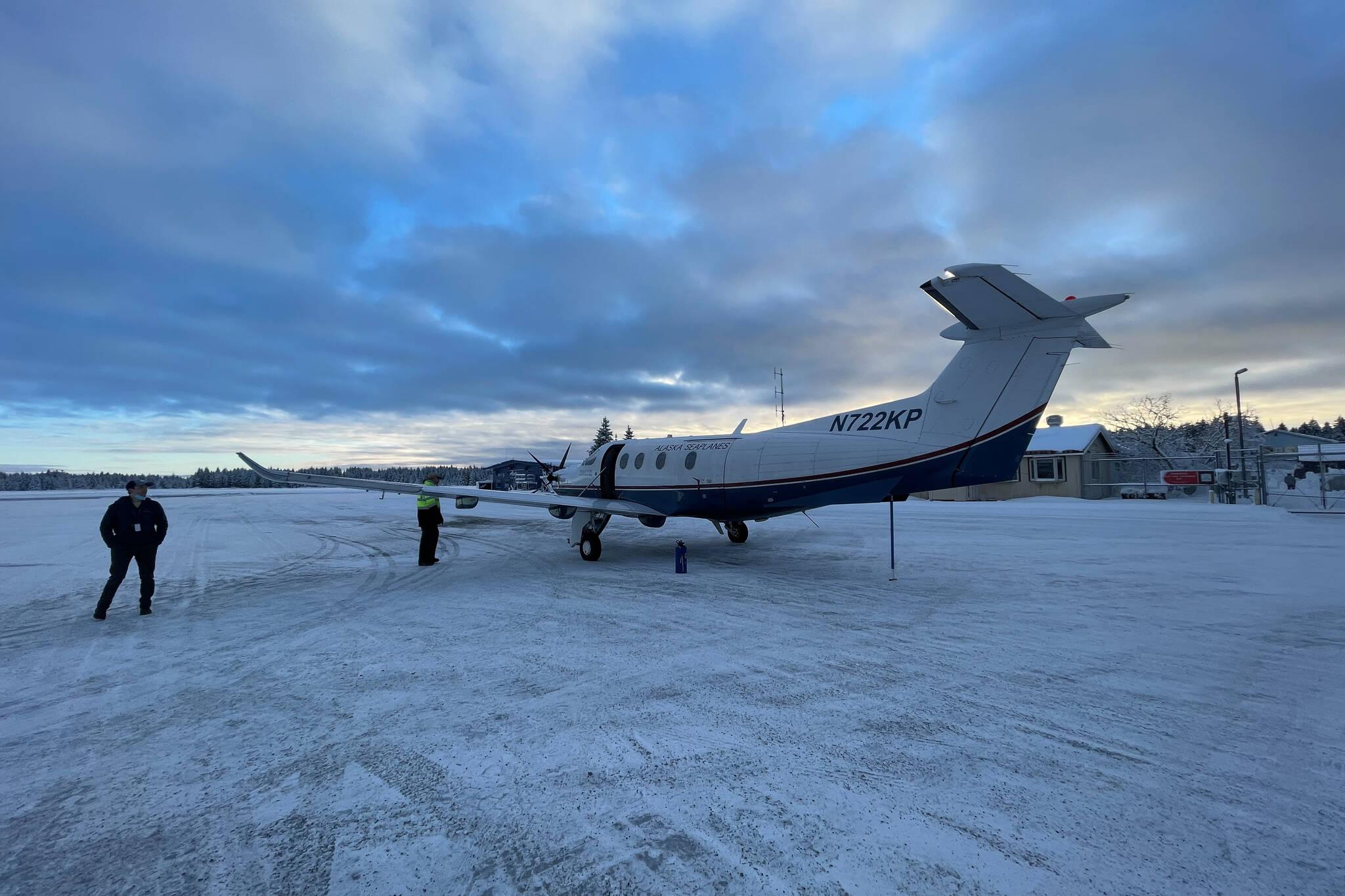 An Alaska Seaplanes Pilatus PC-12 sits on the tarmac at Yakutat Airport on Dec. 5, 2021, a charter flight to help stranded travelers leave after an airport instrument failure prevented any commercial flights from reaching the small city. The National Weather Service is currently working on fixing the problem. (Courtesy photo / Norton Gregory)