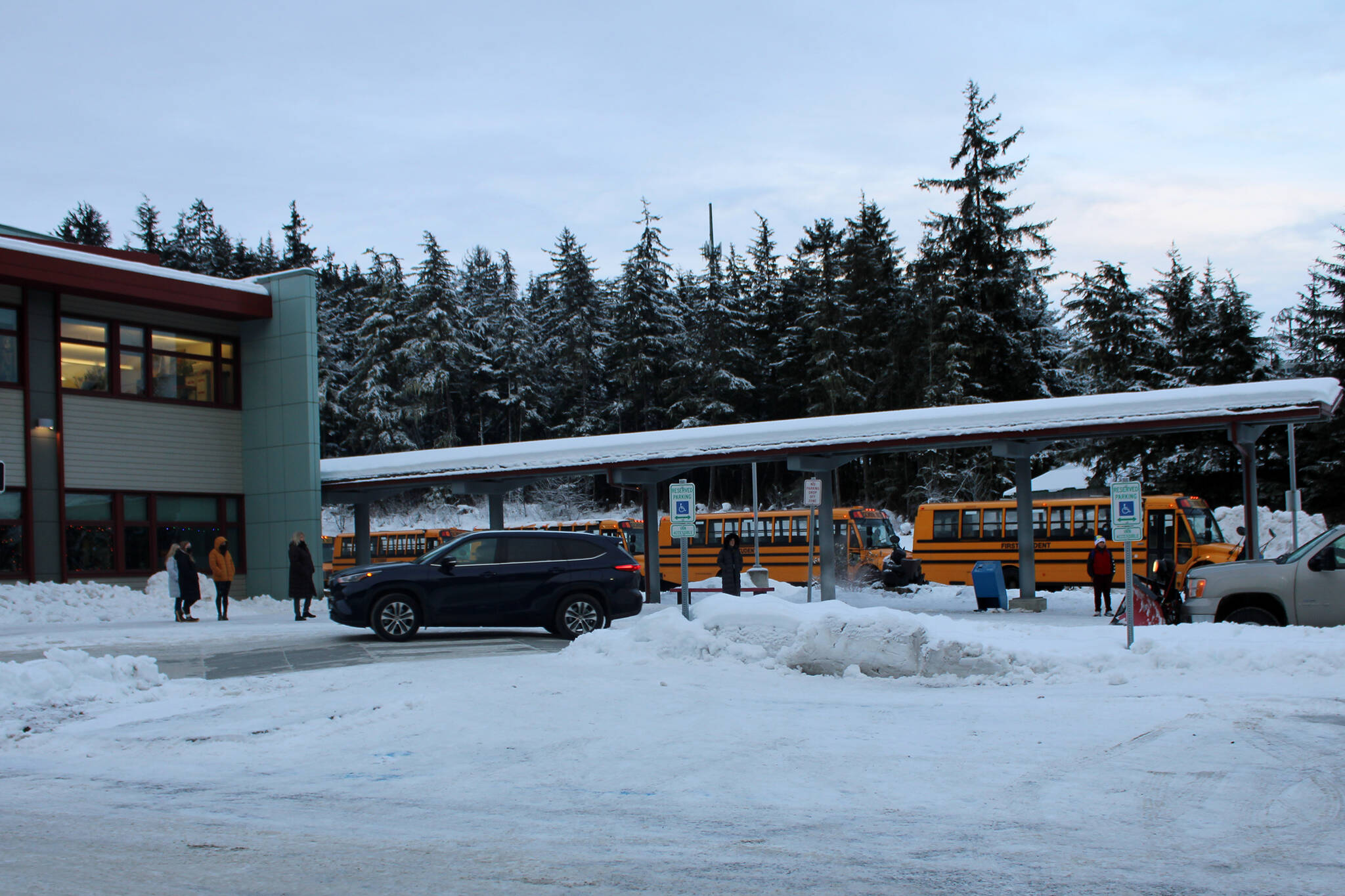 Dana Zigmund/Juneau Empire 
Buses leave Auke Bay Elementary School at the end of the school day on Dec. 16. Auke Bay is one of the school buildings that was renovated using the state’s school bond debt reimbursement program that allows municipalities to renovate eligible schools by reimbursing about 70% of the cost of the project if it is approved by a referendum. This type of debt funding was also used to renovate Sayéik: Gastineau Community School and Harborview elementary schools. In recent years, the state had not provided the full reimbursement amount. However, Gov. Mike Dunleavy proposed full funding for the program in the budget he unveiled Wednesday.