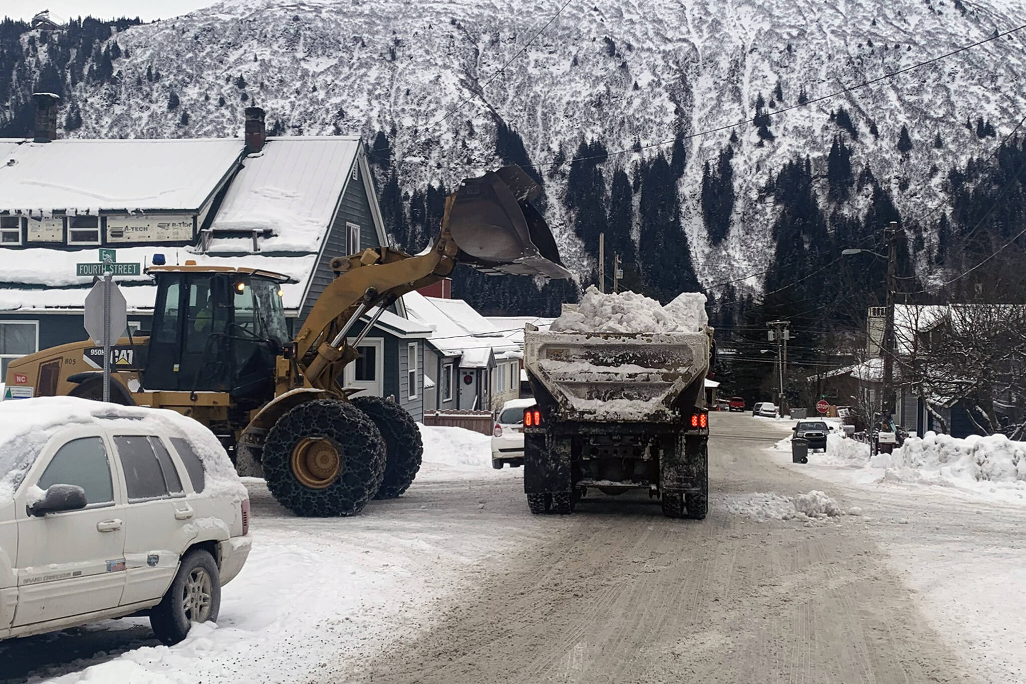 City crews remove snow near 4th and E Streets in Douglas on Monday, Dec. 20. (Dana Zigmund/Juneau Empire)