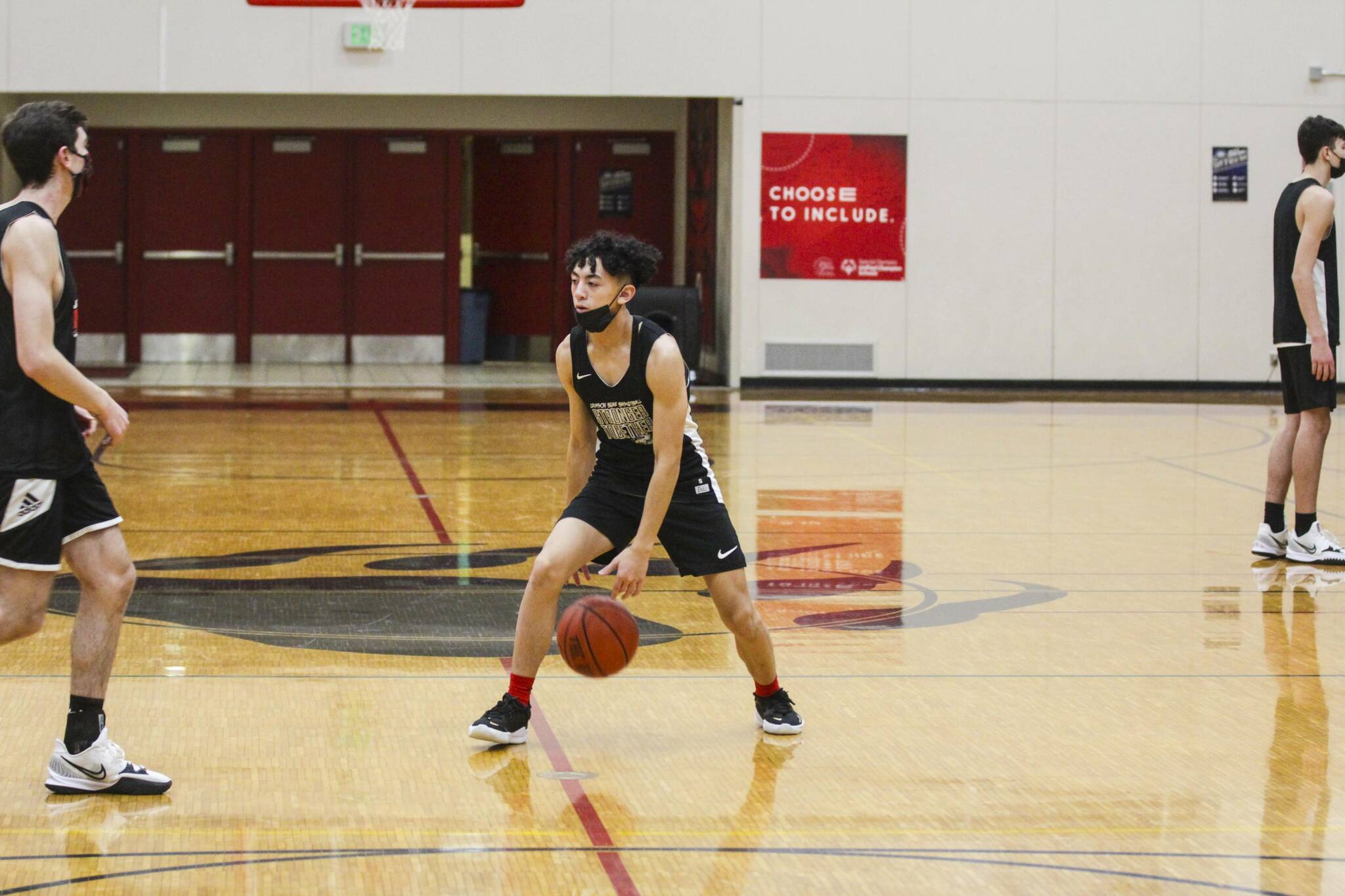 Alwen Carrillo, player for the Juneau-Douglas High School: Yadaa.at Kalé, dribbles during practice on Dec. 14, 2021. Both JDHS teams will compete in the Capital City Classic beginning on Dec. 27, 2021. (Michael S. Lockett / Juneau Empire)