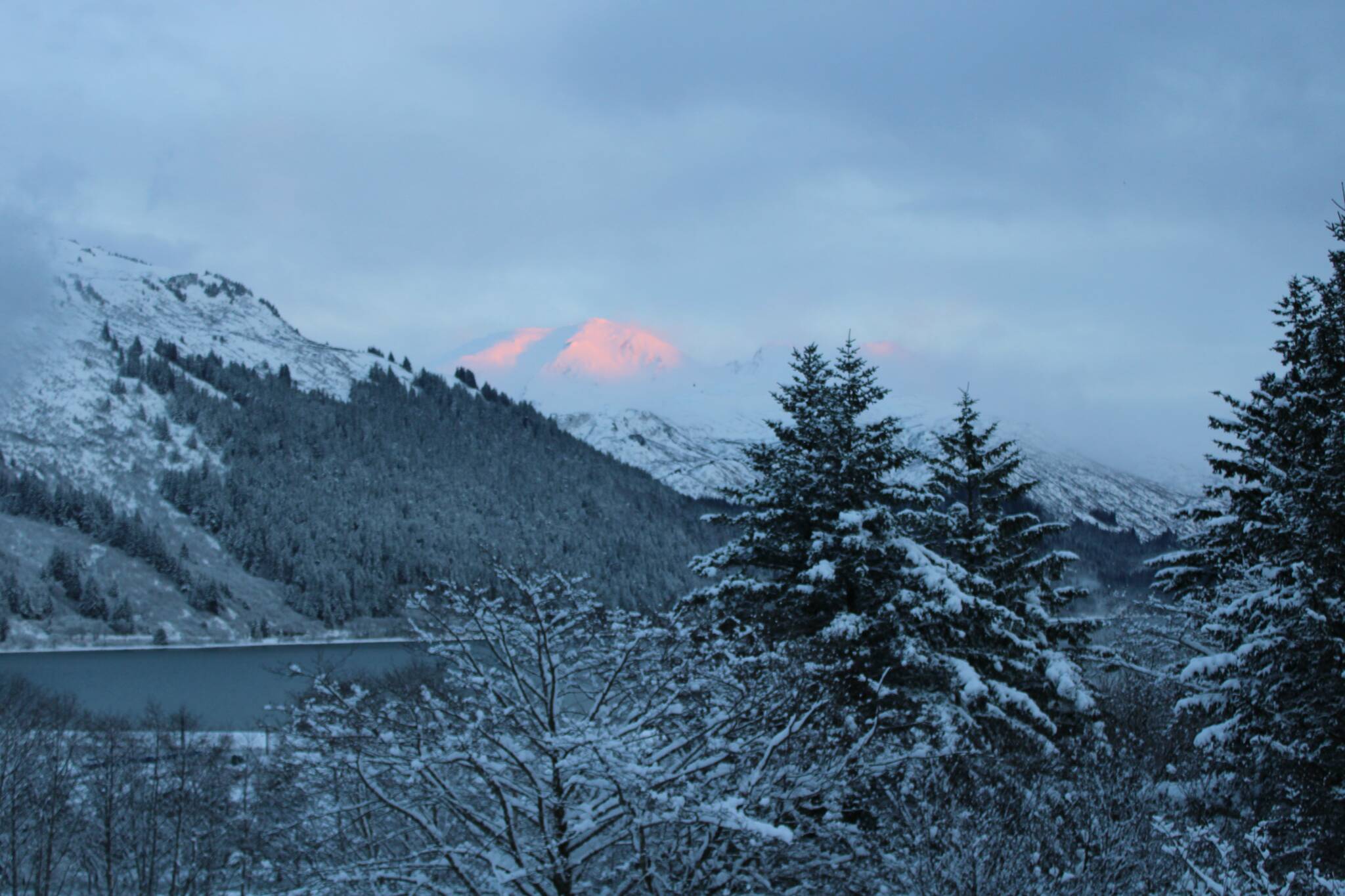 Clearing skies appeared over the Gastineau Channel late in the afternoon on Tuesday, Dec. 21, after a quick-moving snowstorm dumped up to 11 inches of snow across the City and Borough of Juneau. (Dana Zigmund/Juneau Empire)