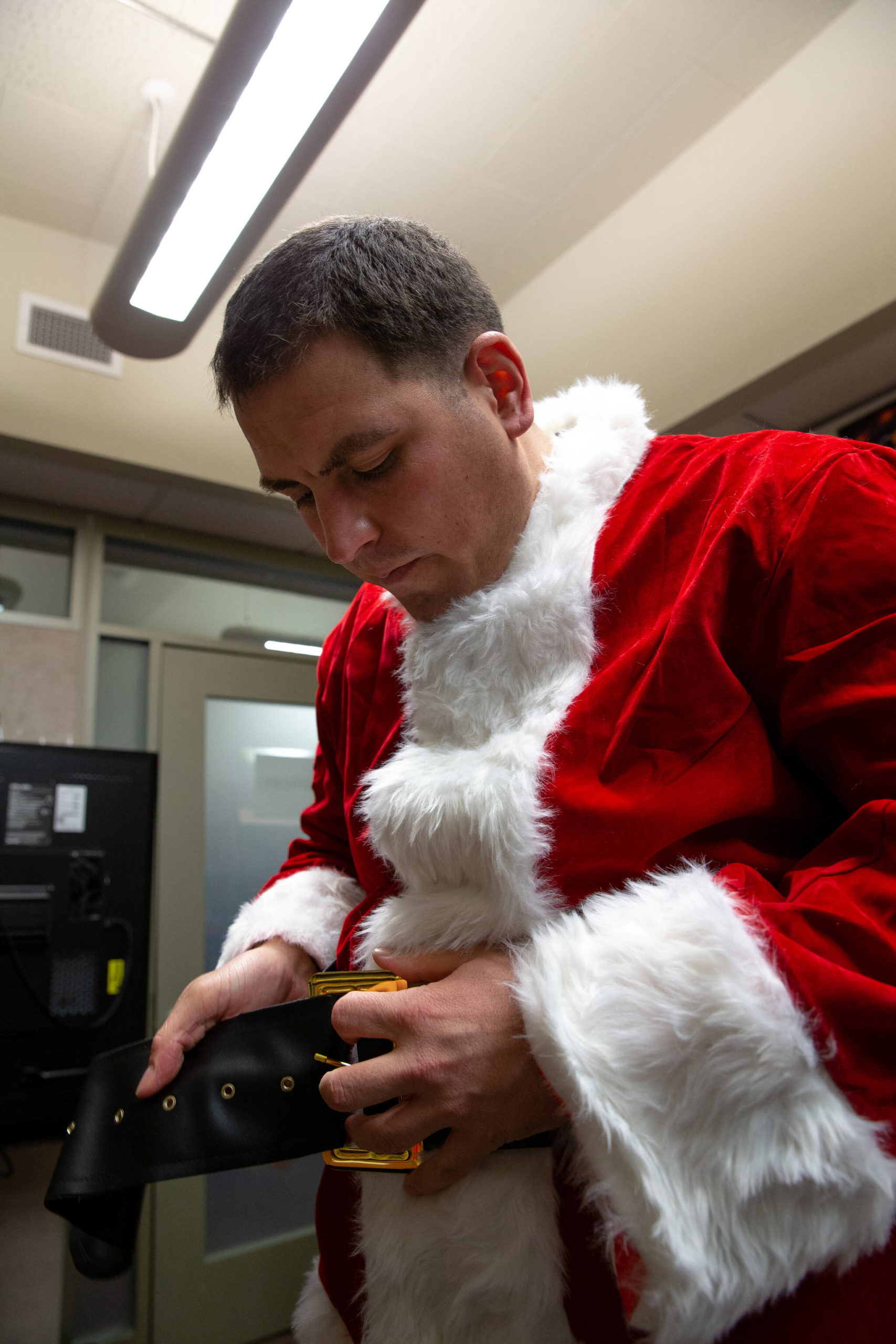 U.S. Marine Corps Staff Sgt. Federico Gomez, the motor transportation chief with Delta Company, 4th Law Enforcement Battalion, Marine Forces Reserve, dresses as Santa Claus before handing gifts to the students of Shungnak School in Shungnak, Alaska, Dec. 8, 2021. (U.S. Marine Corps / Cpl. Brendan Mullin)