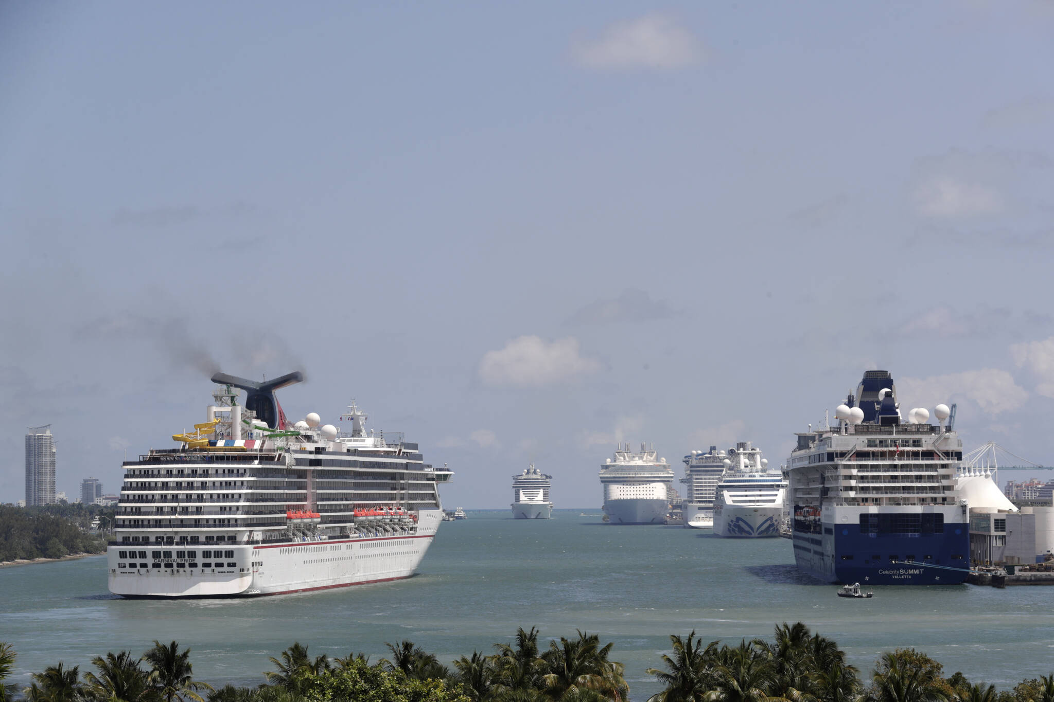 Cruise ships float at PortMiami, on April 7, 2020, in Miami. The U.S. Centers for Disease Control and Prevention is now warning people not to cruise regardless of their vaccination status because of an increase in cases fueled by the omicron variant detected in ships. (AP Photo / Lynne Sladky, File)
