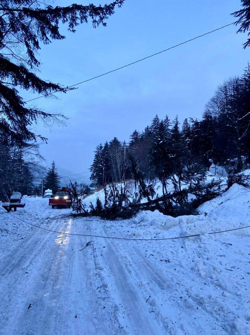 Crews from Alaska Electric Light and Power responded to a power outage on Thane Road on Monday morning. An avalanche blocking the road delayed efforts to restore power to the area, according to officials at the utility. (Download/AEL&P Facebook page)