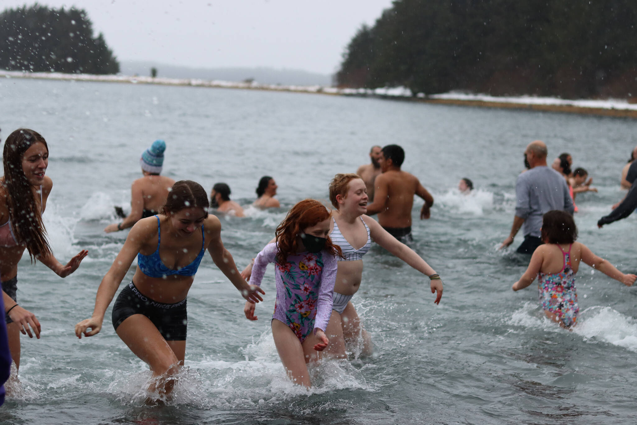 Participants rush back to shore following the 2022 Polar Dip on Saturday. After a pandemic-induced break last year, the long-running event returned to Auke Recreation Area. (Ben Hohenstatt / Juneau Empire)
Participants rush back to shore following the 2022 Polar Dip on Saturday. After a pandemic-induced break last year, the long-running event returned to Auke Recreation Area. (Ben Hohenstatt / Juneau Empire)