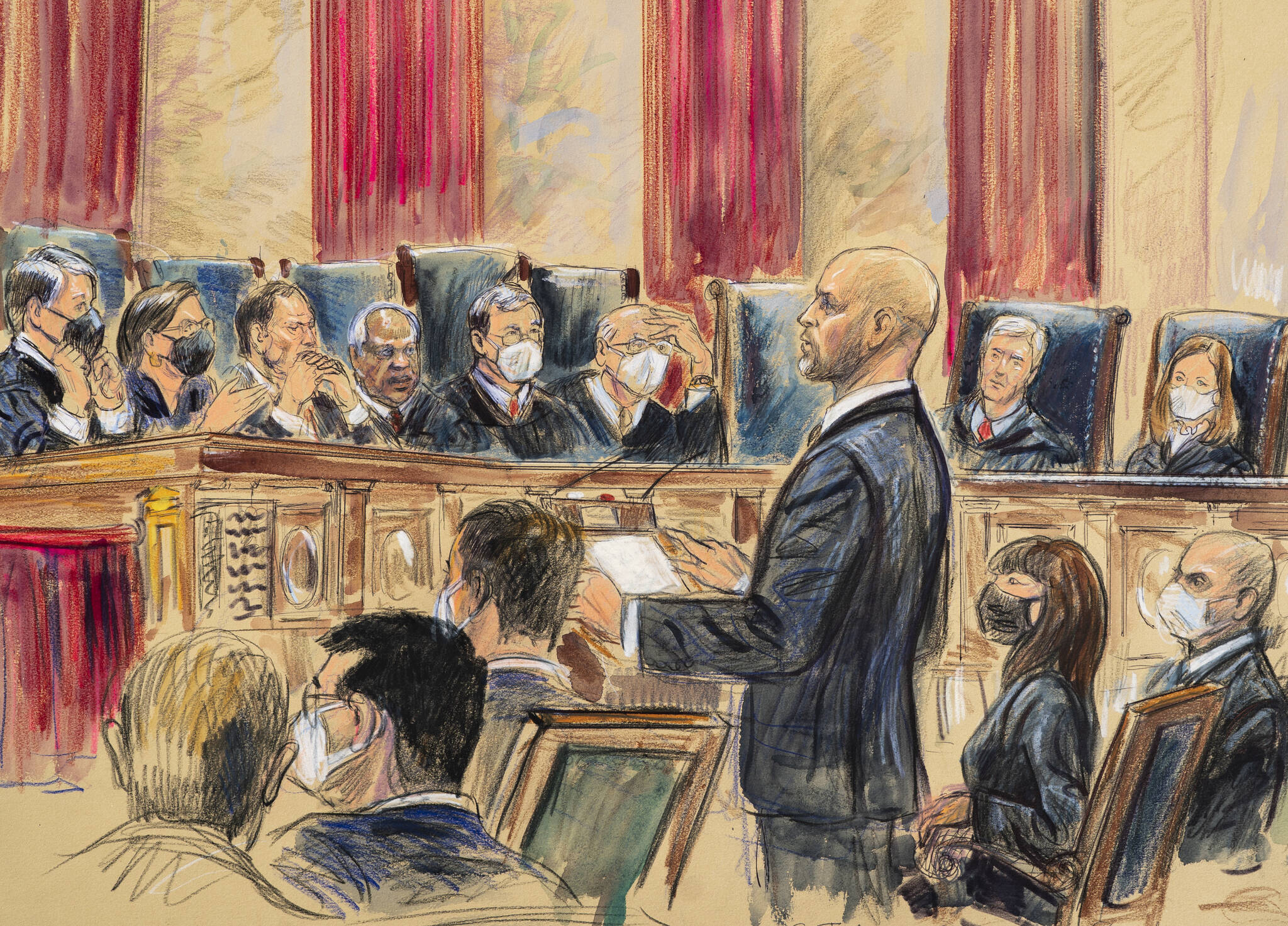 This artist sketch depicts lawyer Scott Keller standing to argue on behalf of more than two dozen business groups seeking an immediate order from the Supreme Court to halt a Biden administration order to impose a vaccine-or-testing requirement on the nation’s large employers during the COVID-19 pandemic, at the Supreme Court in Washington, Friday, Jan. 7, 2022. Solicitor General Elizabeth Prelogar, the Biden administration’s top Supreme Court lawyer, is seated at right. (Dana Verkouteren)