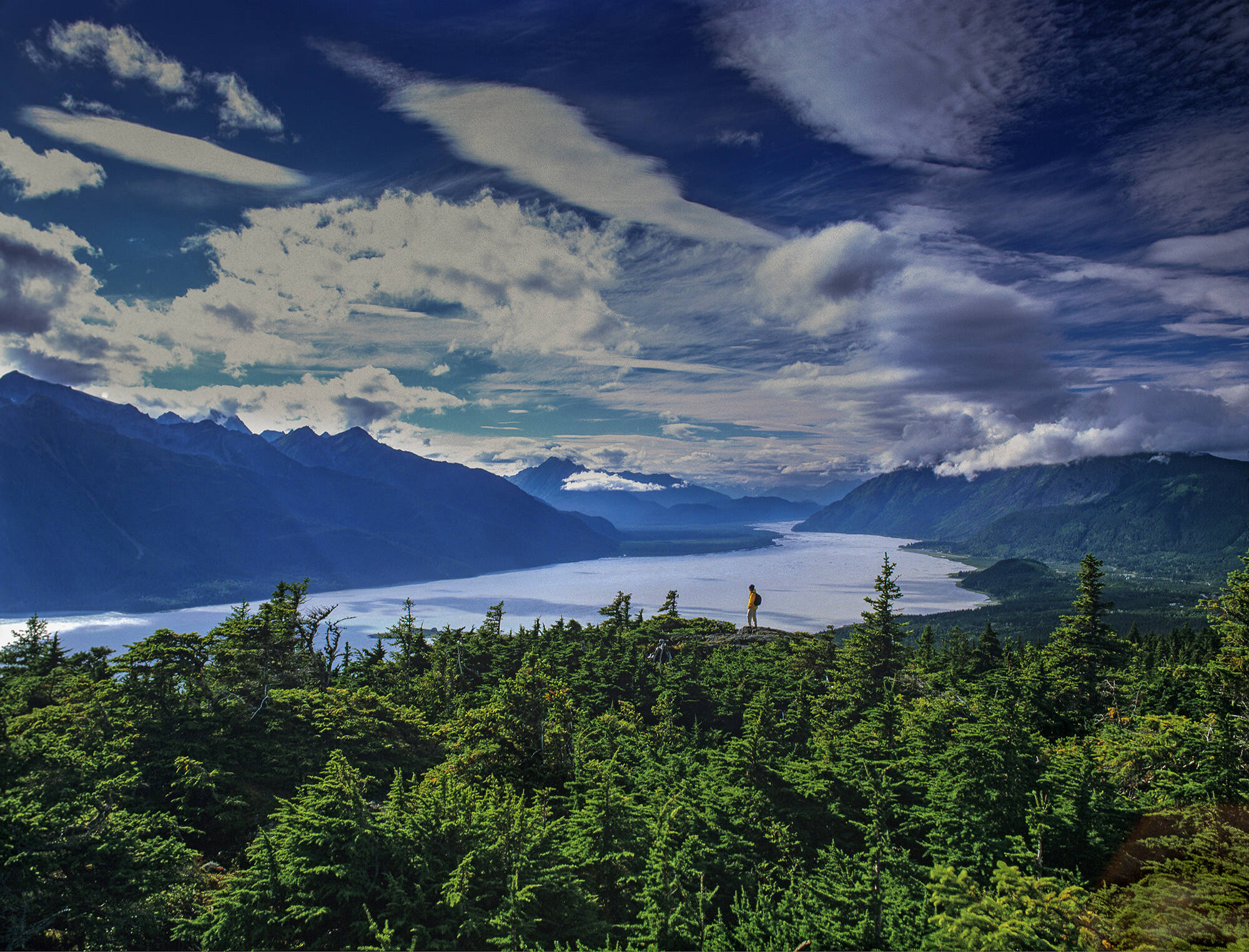 Courtesy Photo / Howie Garber 
A hiker looks out over forests, mountains, and ocean channels that comprise part of the Tongass National Forest, or SeaBank, in Southeast Alaska.