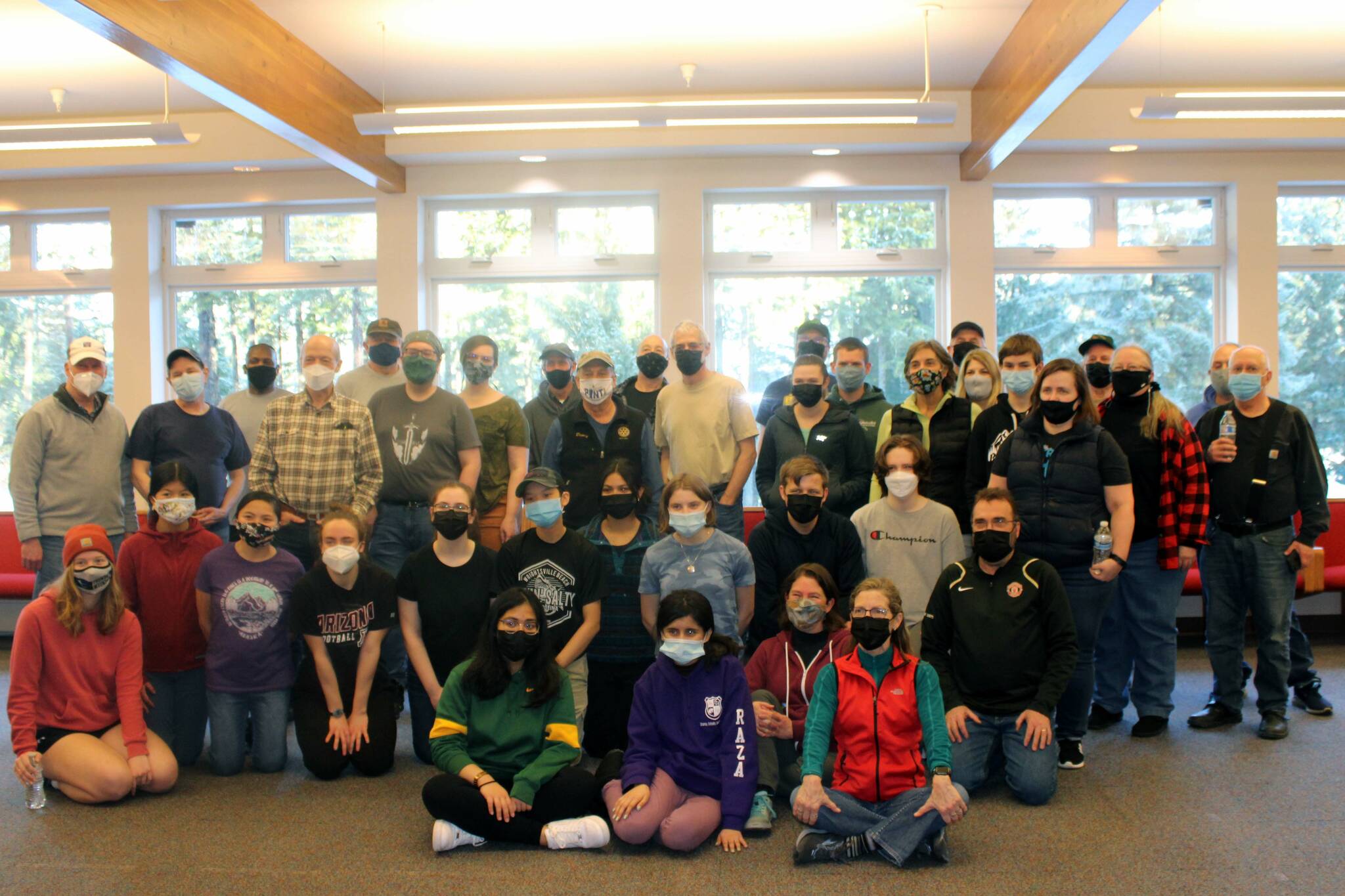 After a day of cleaning, volunteers gathered for a picture at Chapel by the Lake on Jan. 17. (Dana Zigmund/Juneau Empire)