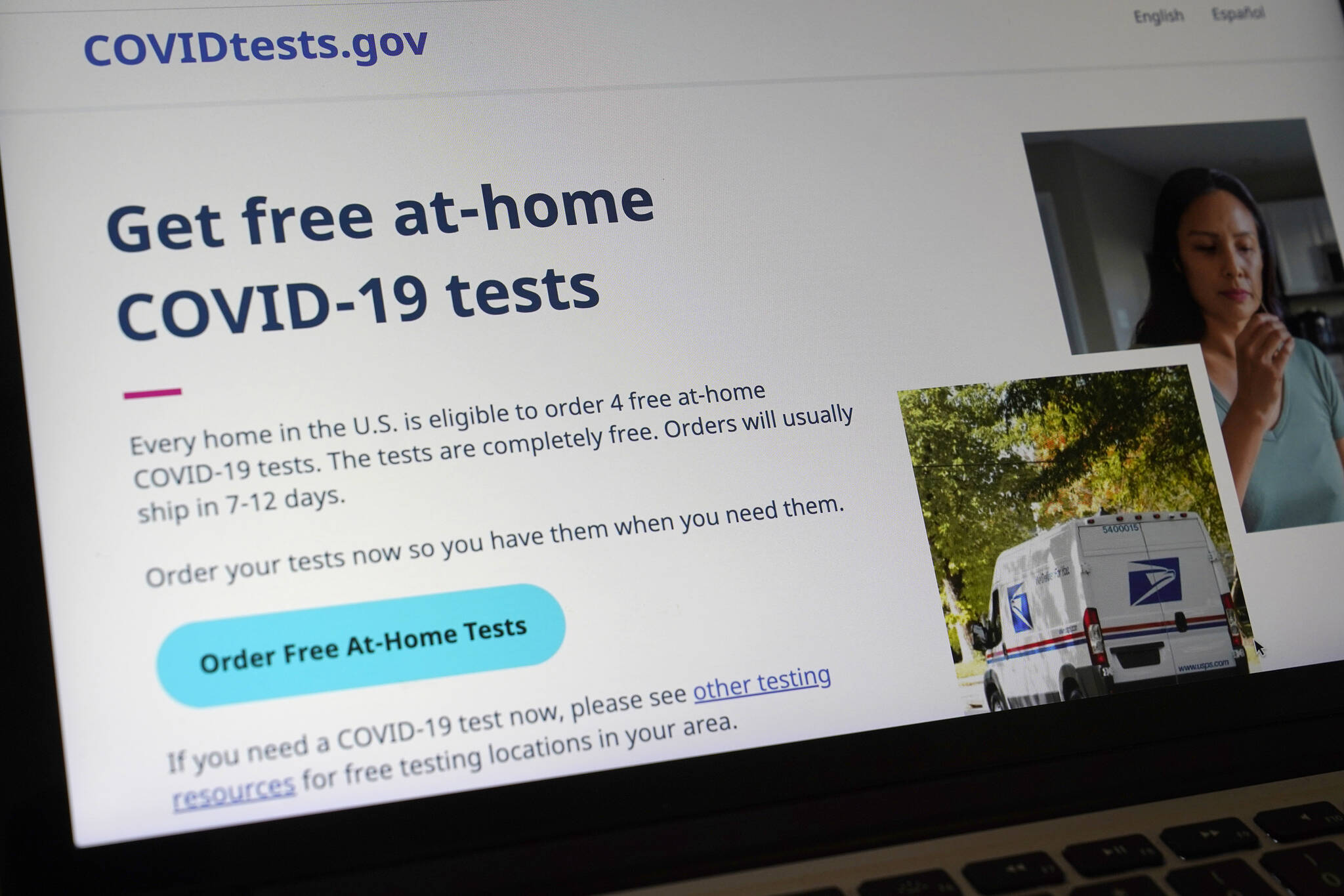 A United States government website is displayed on a computer, Wednesday, Jan. 19, 2022, in Walpole, Mass., that features a page where people can order free, at-home COVID-19 tests. The website, COVIDTests.gov, allows people to order four at-home tests per residence and have them delivered by mail. (AP Photo/Steven Senne)