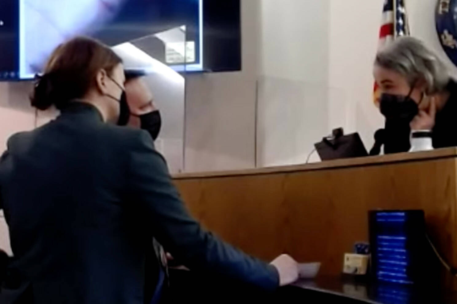 District Attorney Angie Kemp and public defender Eric Hedland consult with Superior Court Judge Amy Mead on Jan. 20, 2022 during a trial of a man accused of killing another man in Yakutat in 2018. (Screenshot)