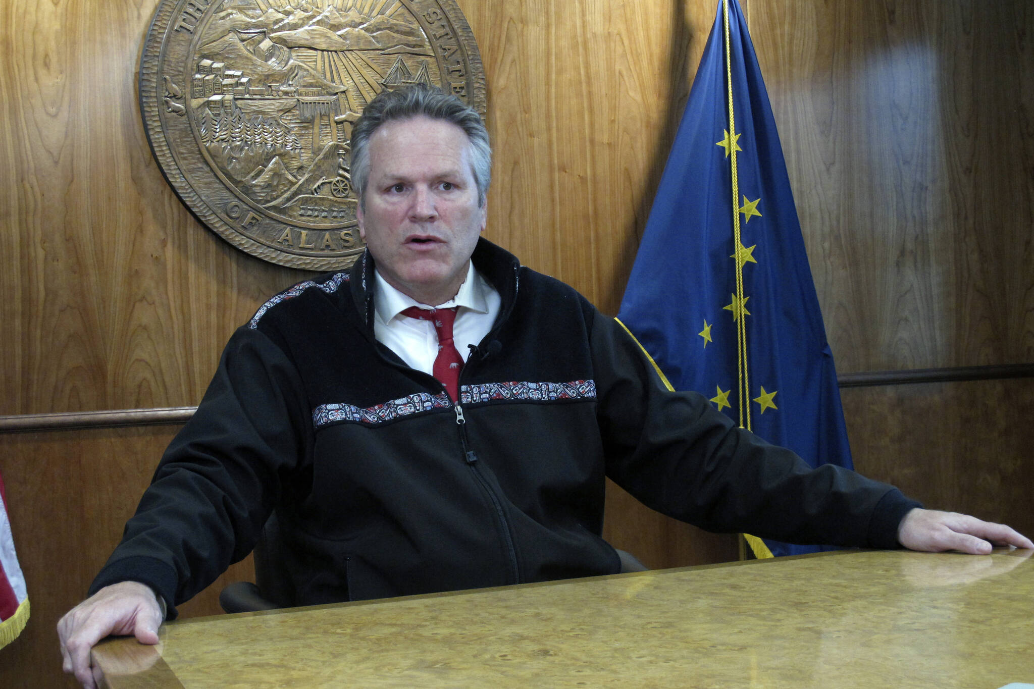 Gov. Mike Dunleavy speaks with reporters during a news briefing on Tuesday, Sept. 14, 2021, in Juneau, Alaska. Dunleavy said he doesn’t see his acceptance of former President Donald Trump’s endorsement as hurting his relationship with the state’s senior U.S. senator, Republican Lisa Murkowski, who voted to convict Trump at his impeachment trial last year and whom Trump has vowed to fight in her reelection bid. (AP Photo / Becky Bohrer)