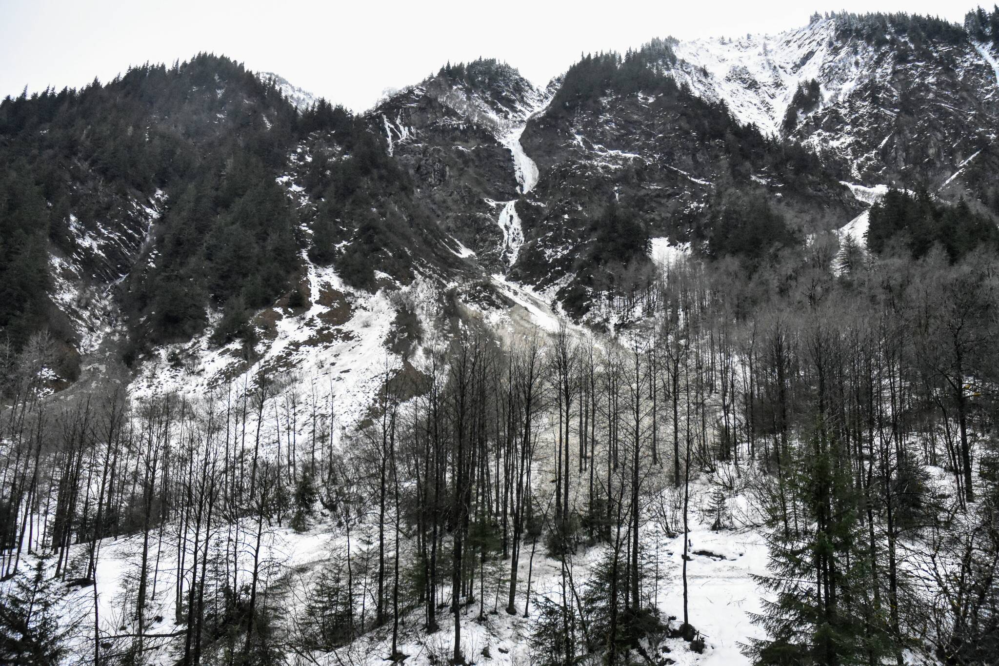 An avalanche above Basin Road covered the Gold Creek Flume Trail on Monday, Jan. 24, 2022, but didn’t affect any structures. Heavy rains over the weekend set records in Juneau and caused several small avalanches in the region. (Peter Segall / Juneau Empire)
