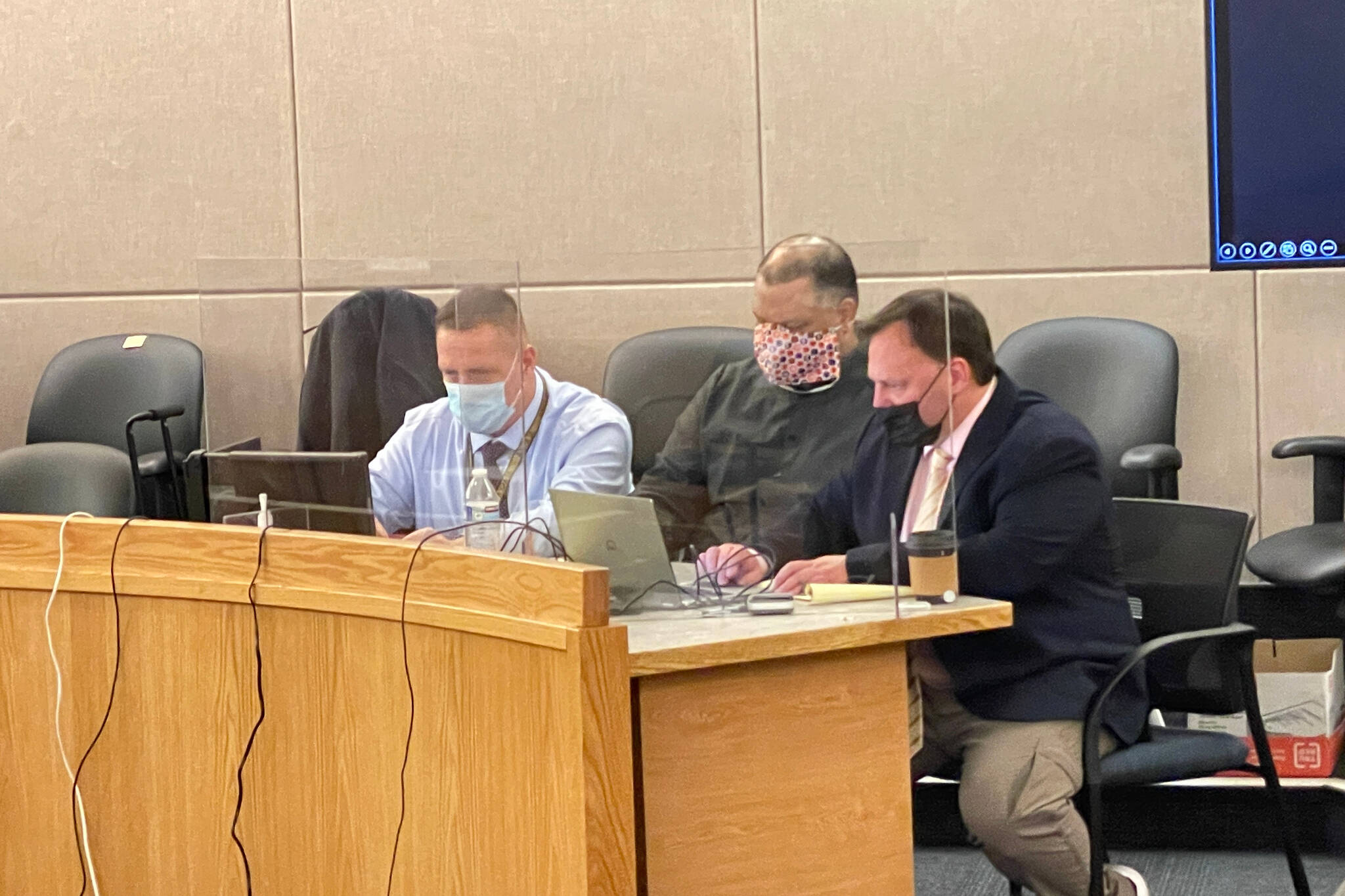 Investigator Markus Bressler, defendant John Stapleton, and public defender Eric Hedland sit in court on Jan. 13, 2022. (Michael S. Lockett / Juneau Empire File)